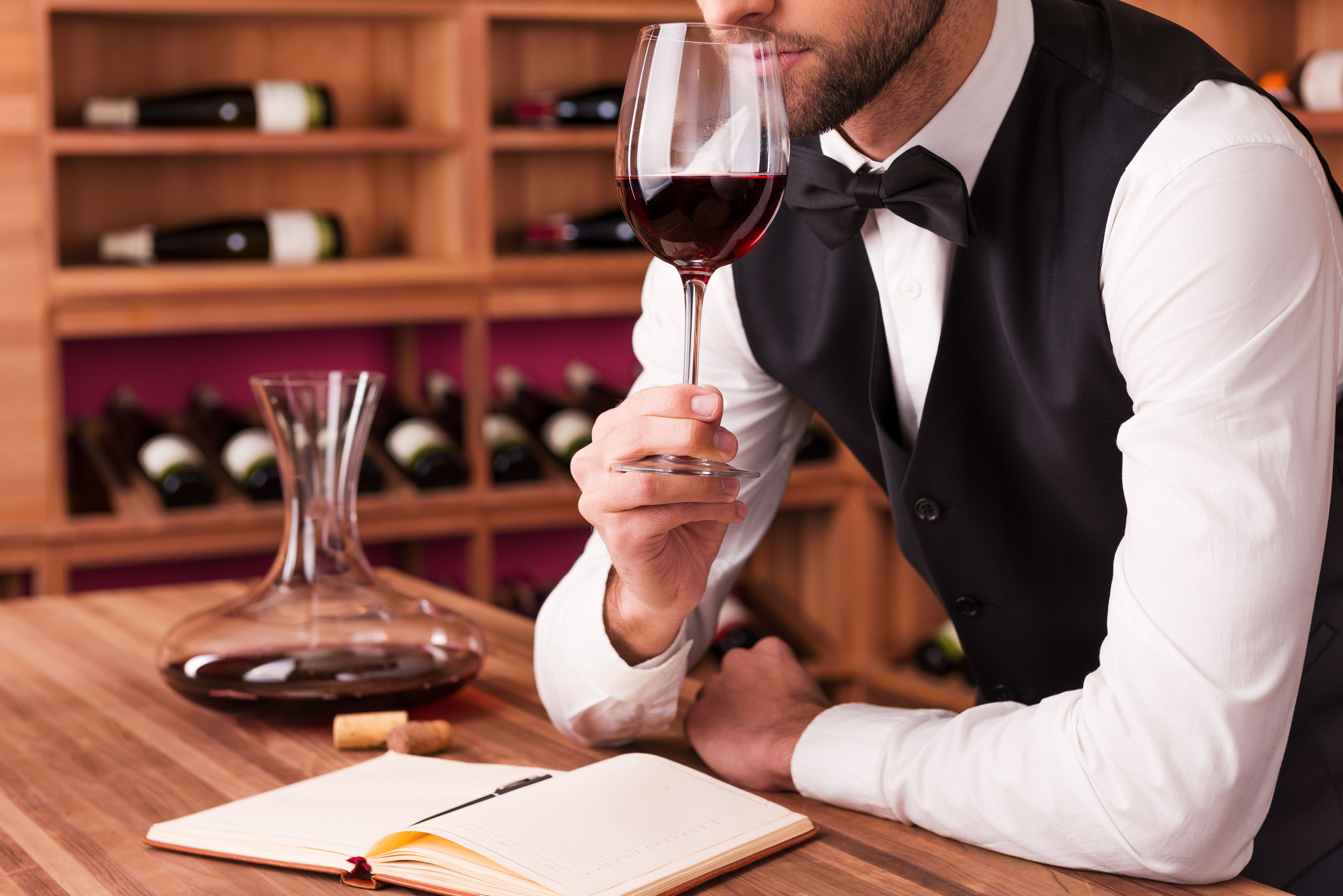 Sommelier examining wine. [08JANUARY2016 FEATURES FOOD DRINK]
