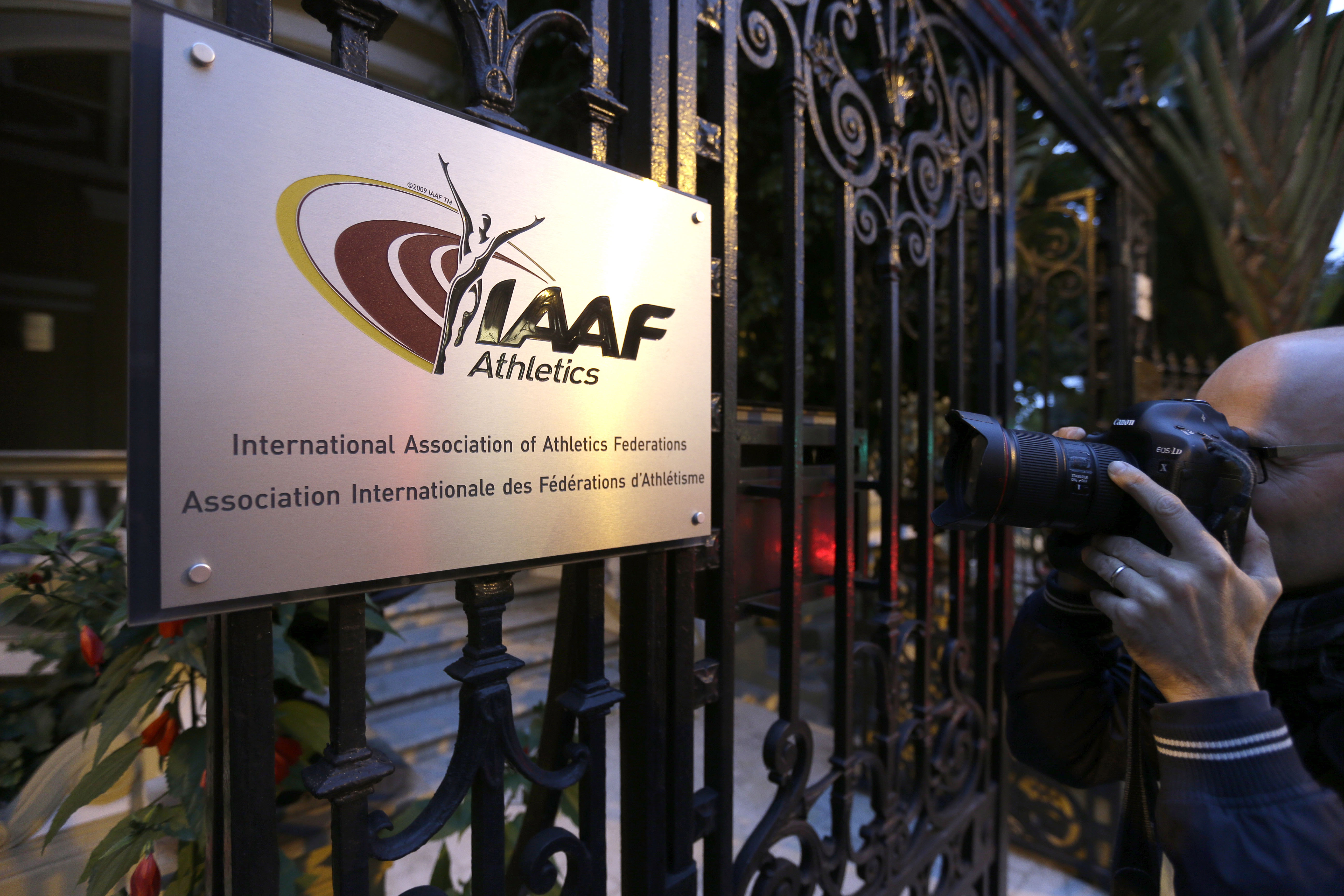 FILE - In this Nov.13, 2015 file photo, a photographer pictures the logo at the IAAF (International Association of Athletics Federations) headquarters in Monaco. French prosecutors have opened an investigation into the decision to award the 2021 track world championships to the American city of Eugene without an open bidding process. (AP Photo/Lionel Cironneau, File)