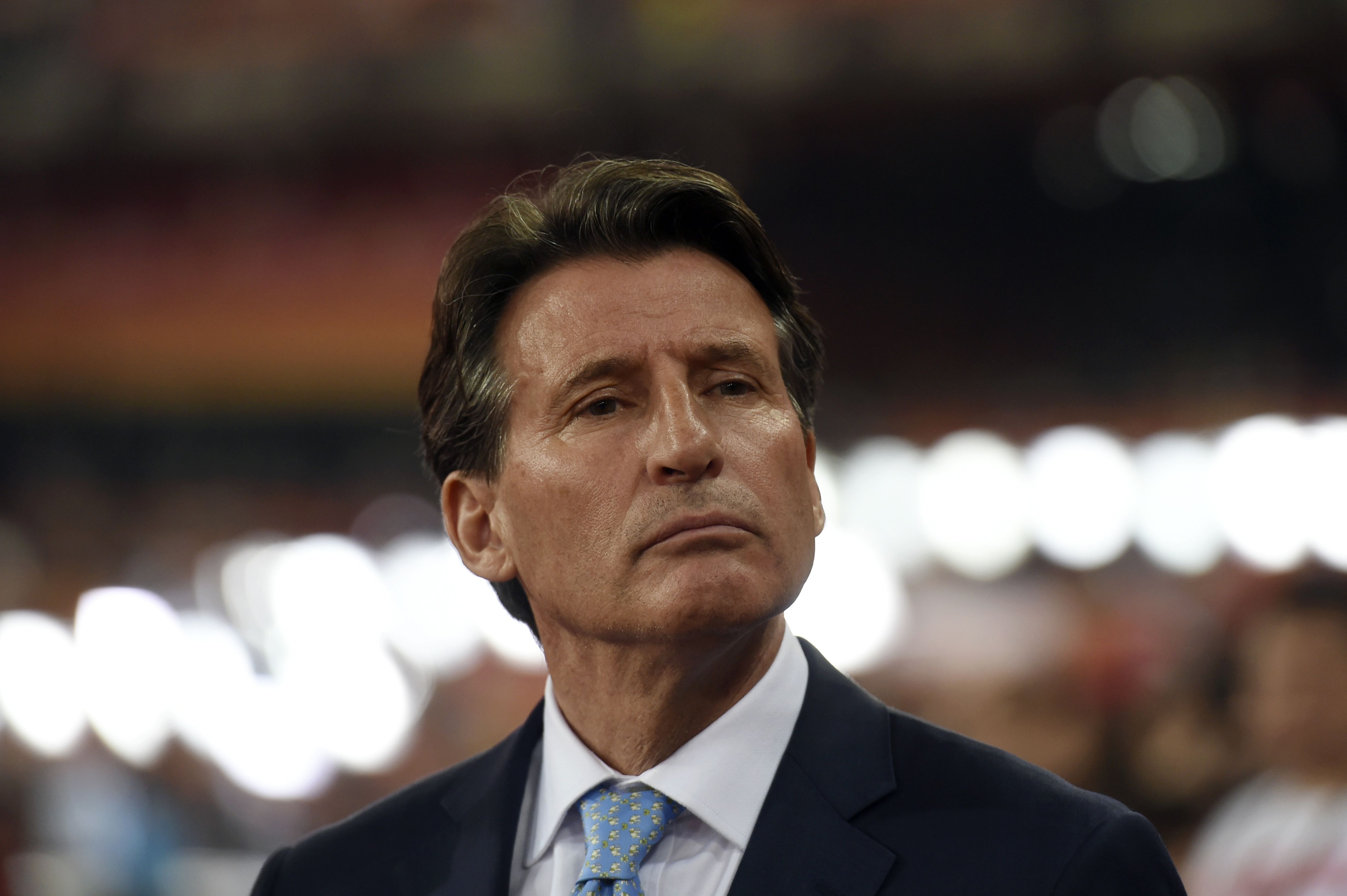 (FILES) -- A file photo taken on August 30, 2015 shows IAAF president Sebastian Coe presenting medals for the women's marathon athletics event at the 2015 IAAF World Championships at the "Bird's Nest" National Stadium in Beijing. Coe has denied allegations of a conflict of interest over his ties with Nike and his role in the 2021 championships being awarded to the sportswear company's home state. Coe, head of the International Association of Athletics Federations (IAAF), told the BBC on November 25, 2015: "I did not lobby anyone on behalf of the Eugene 2021 bid" in the US state of Oregon. AFP PHOTO / GREG BAKER