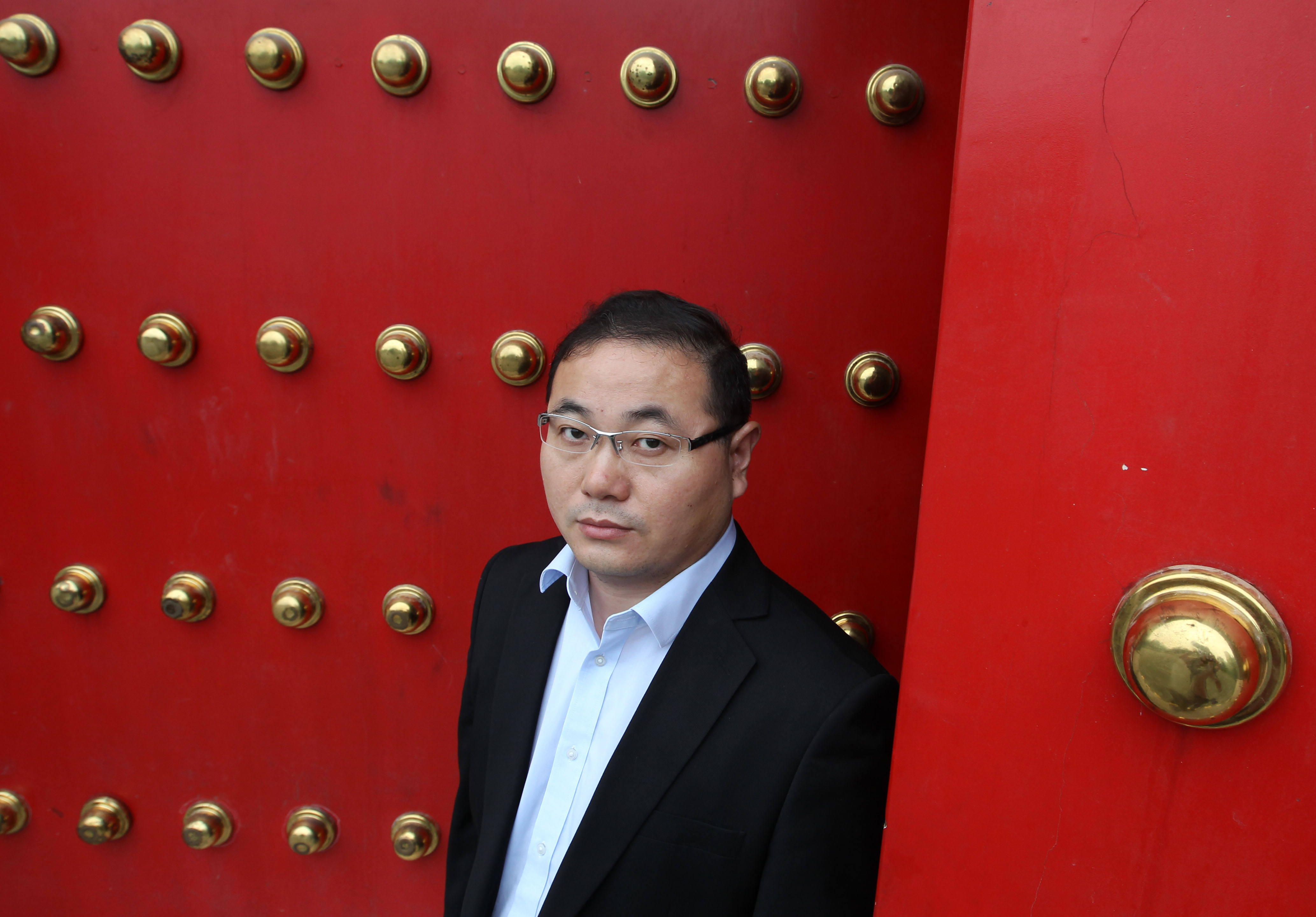Wang Dianxue, a lawyer, poses for a photo during an interview in Beijing. 31AUG15 === Photo by Simon Song ===