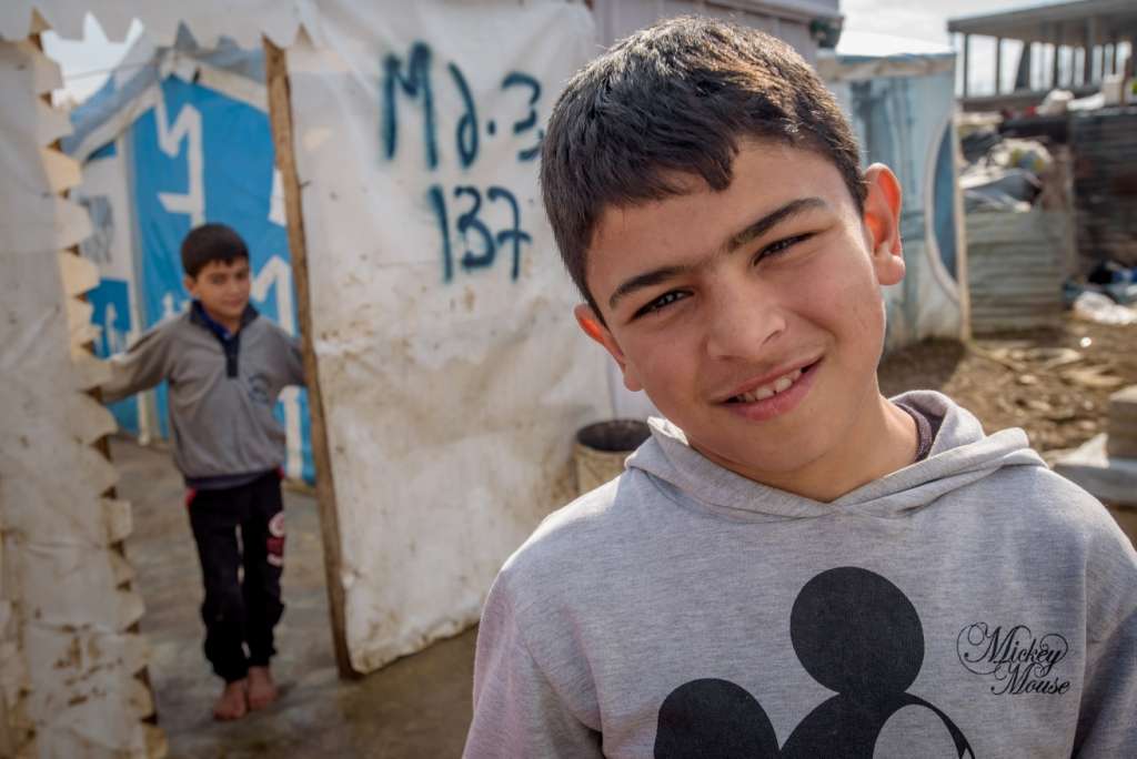 Ali vividly remembers the horrific attacks at his school. After fleeing Syria, the 12-year-old and his family now live in the Bekaa Valley of Lebanon. Ali does not attend school and sells tissue paper on the street to earn money for his family. Photo: World Vision