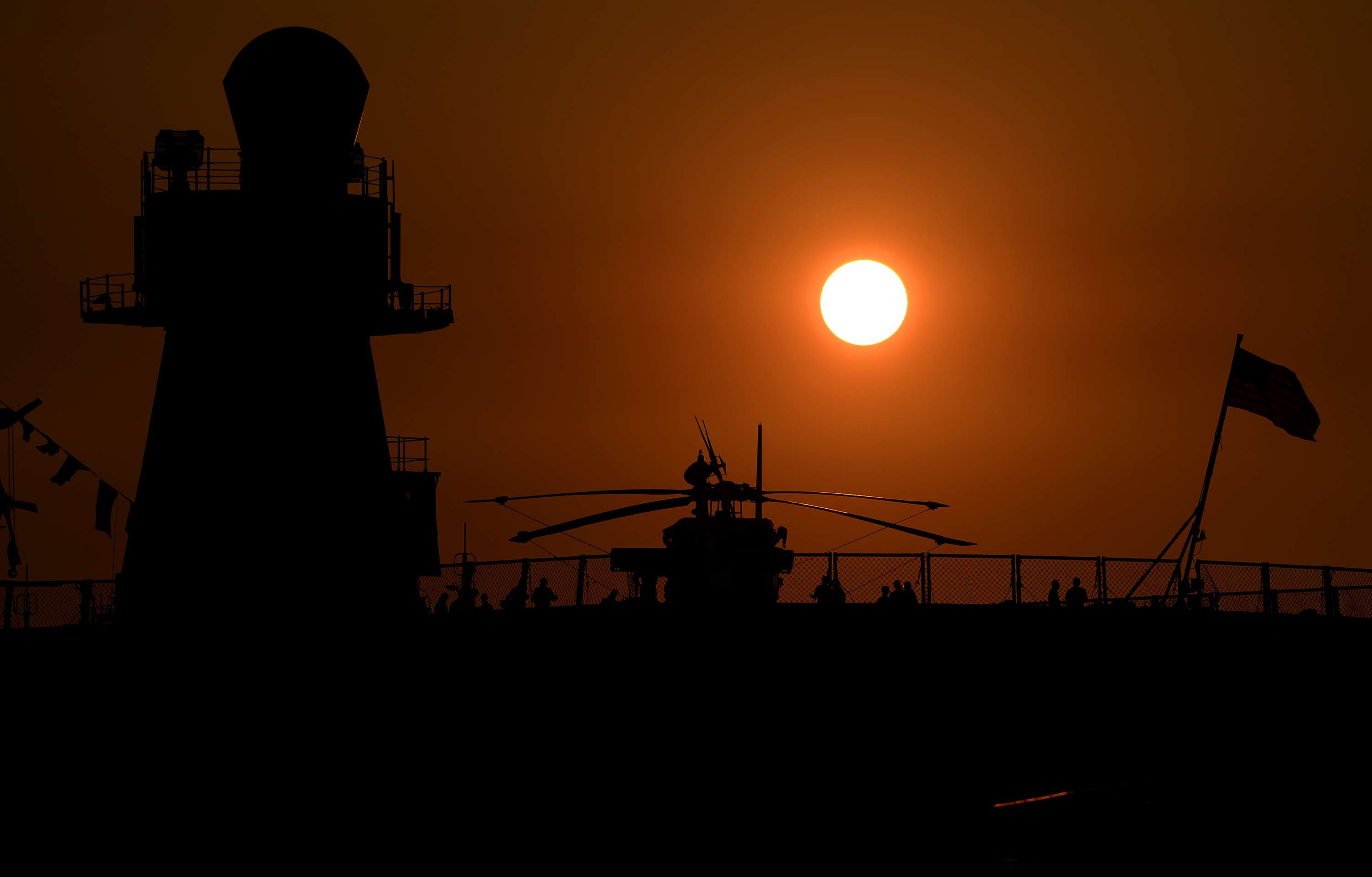 The sun sets behind US Navy ship USS Blue Ridge docked in Manila. Washington is boosting its military assistance to the Philippines. Photo: AFP