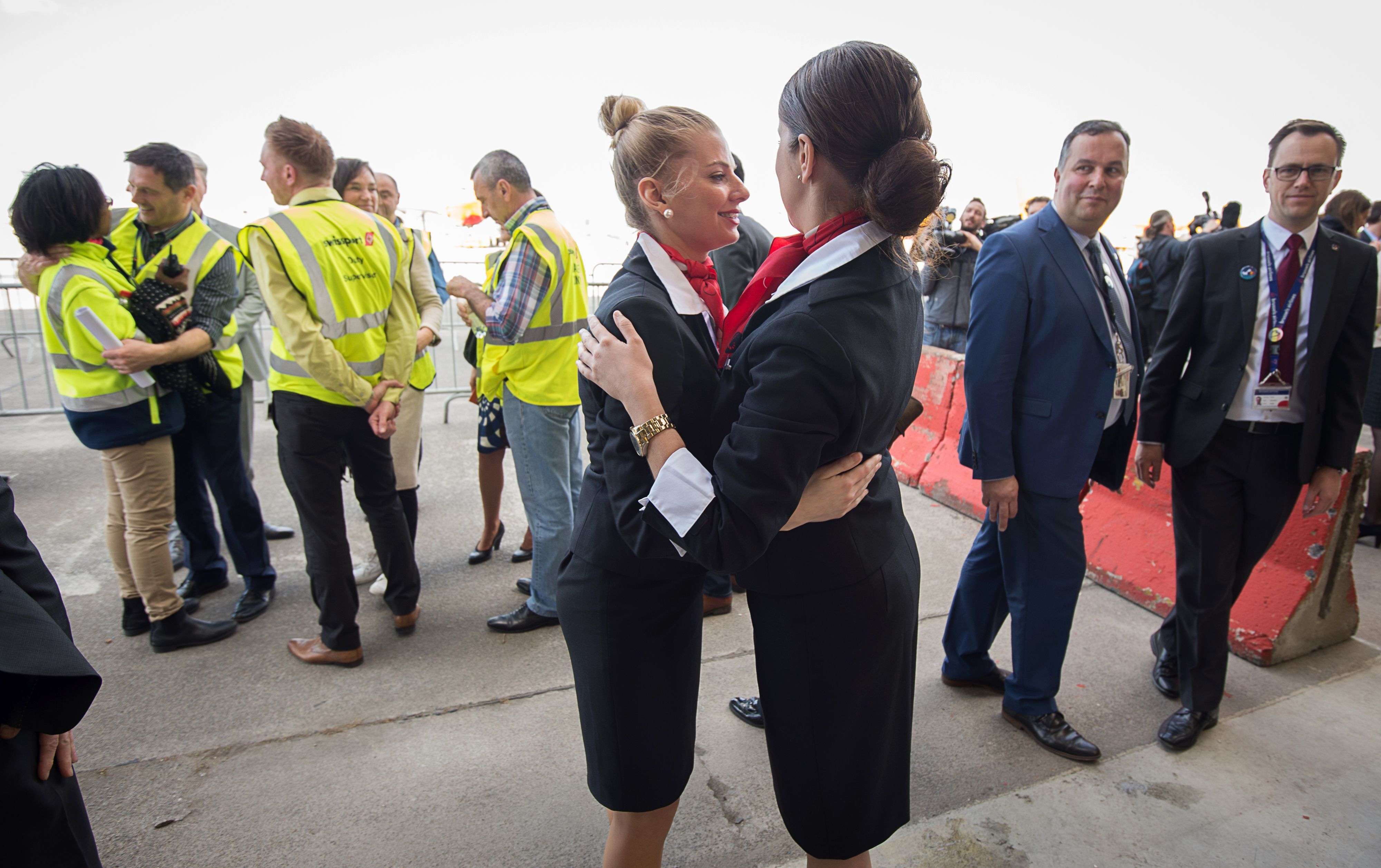 Emotional Brussels airport employees celebrate on Sunday after the first flight since the recent terrorist attacks took off from Brussels’ Zaventem Airport. Photo: AFP