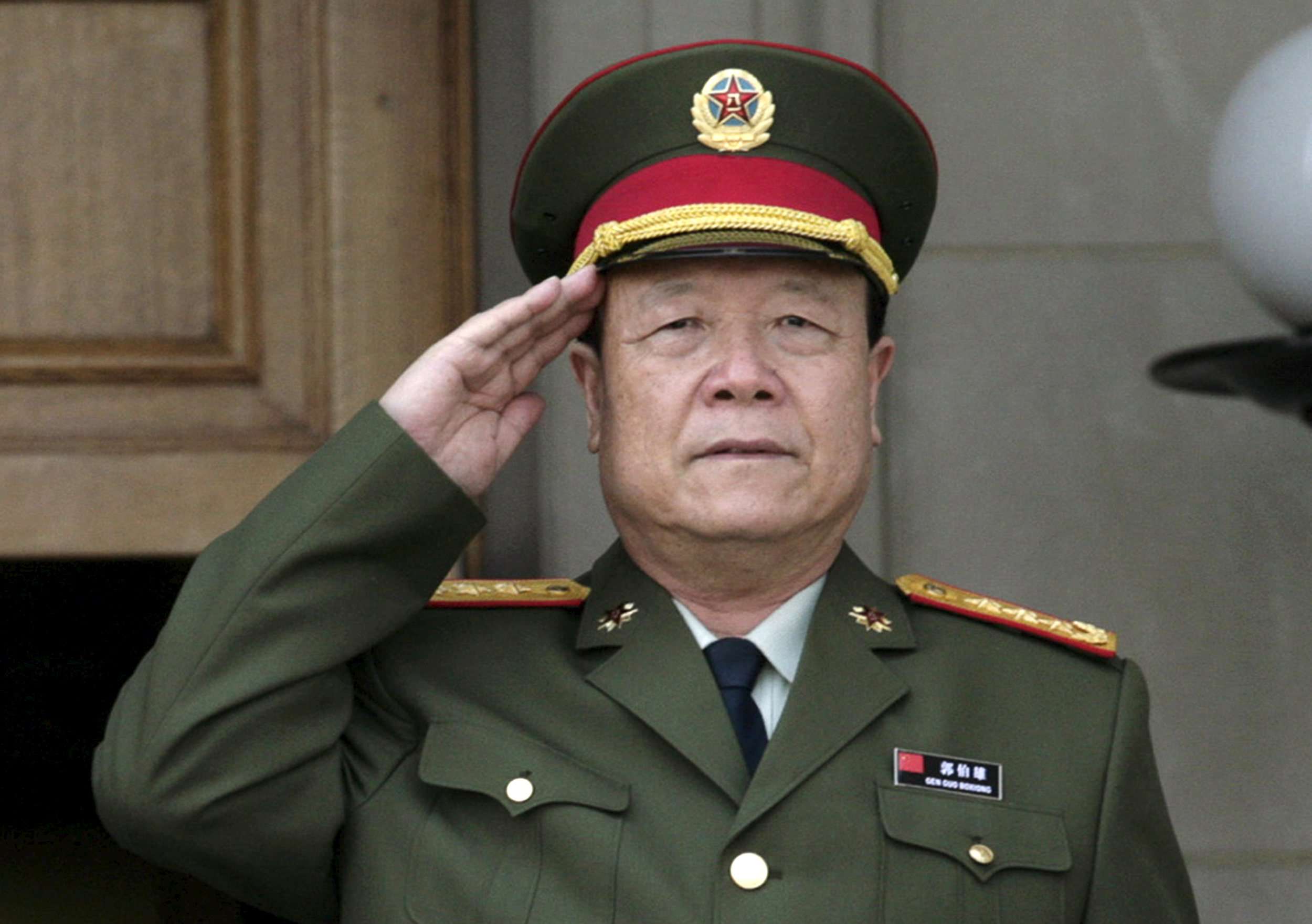 China's former top general Guo Boxiong, pictured at an official ceremony in 2006, is likely to be charged with accepting 80 million yuan in bribes. File photo: Reuters