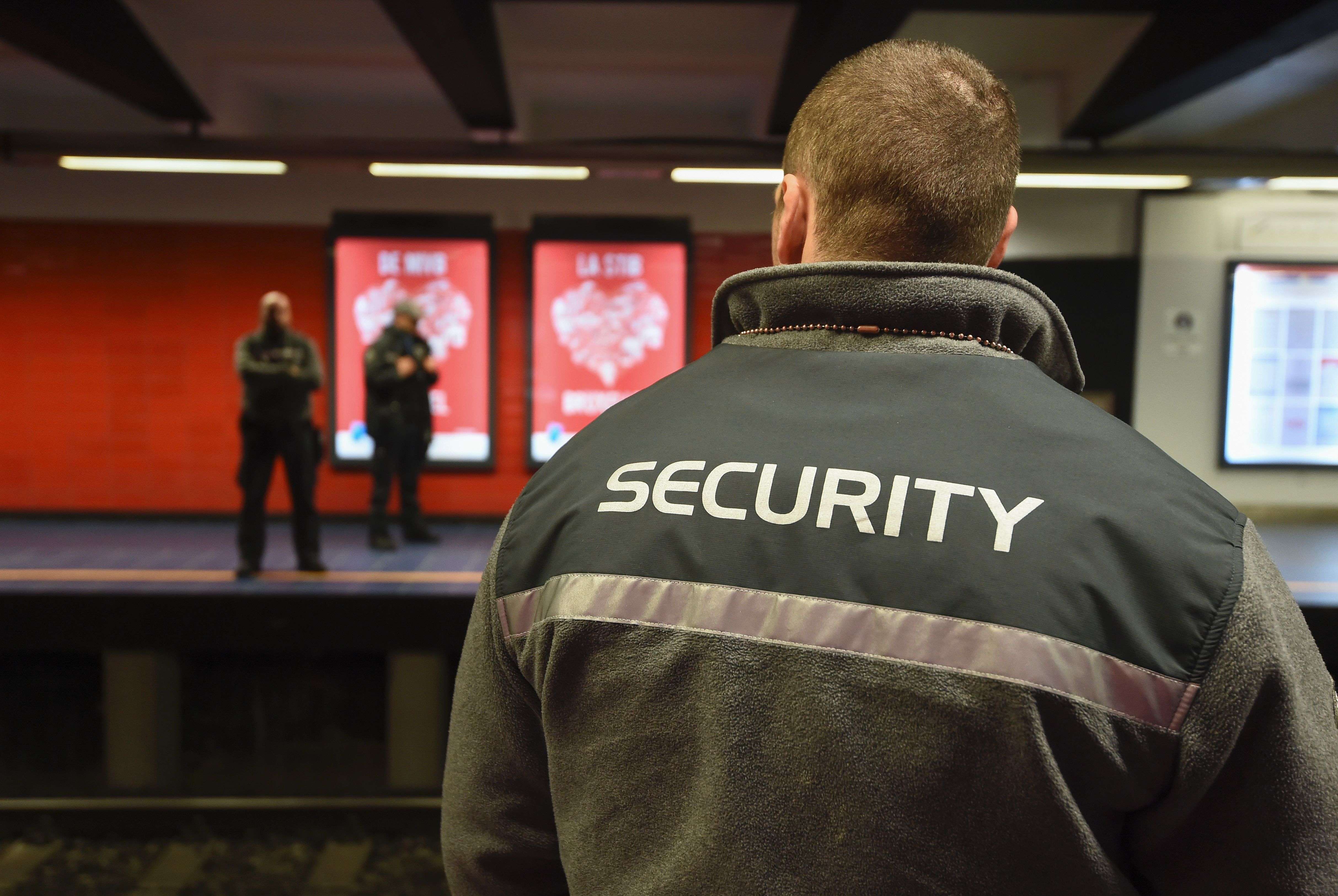 Security agents stand at the Maelbeek metro station in brussels. Photo: AFP
