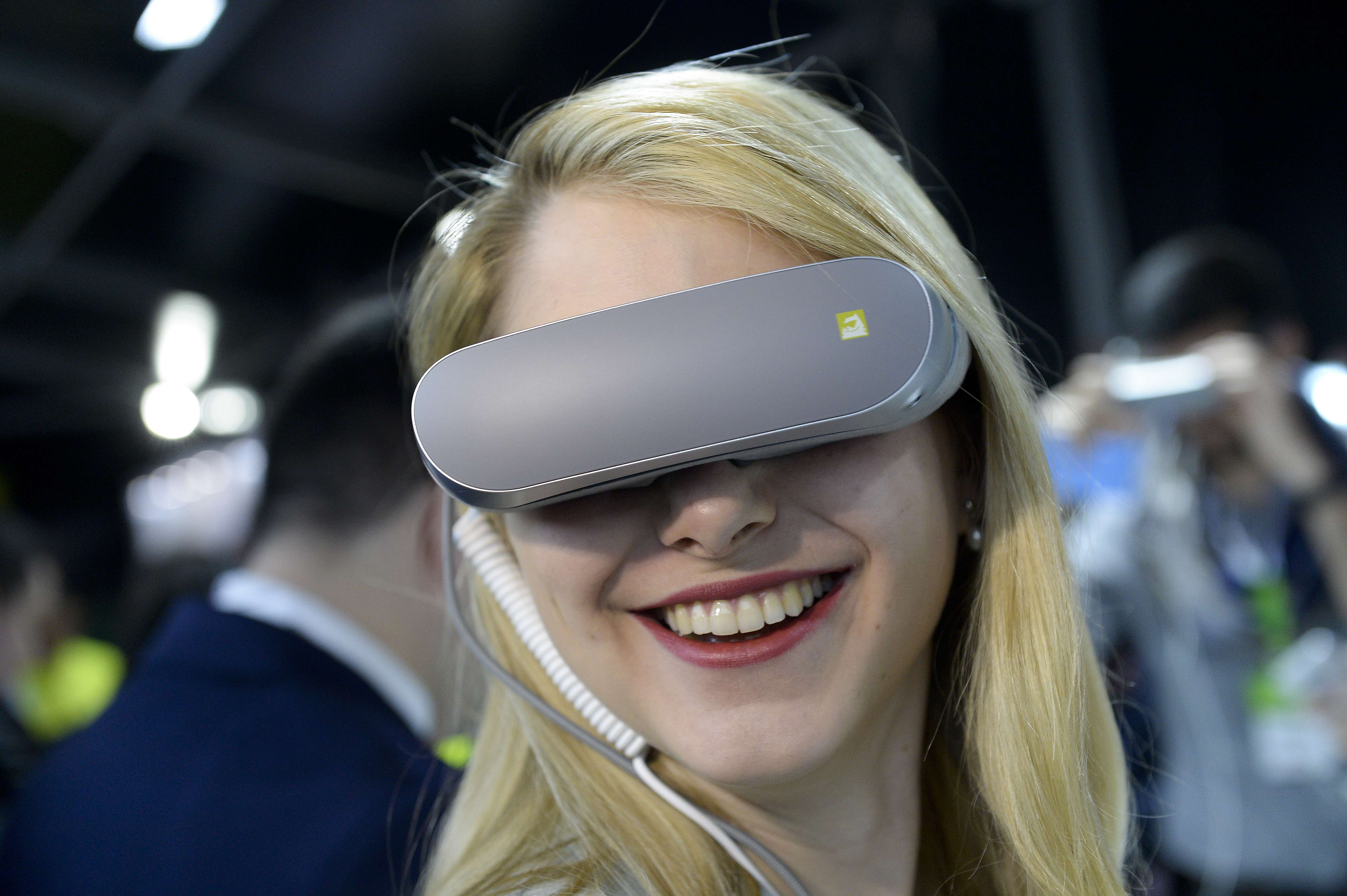 A visitor uses LG’s new 360 VR device at the Mobile World Congress in Barcelona. Photo: AFP