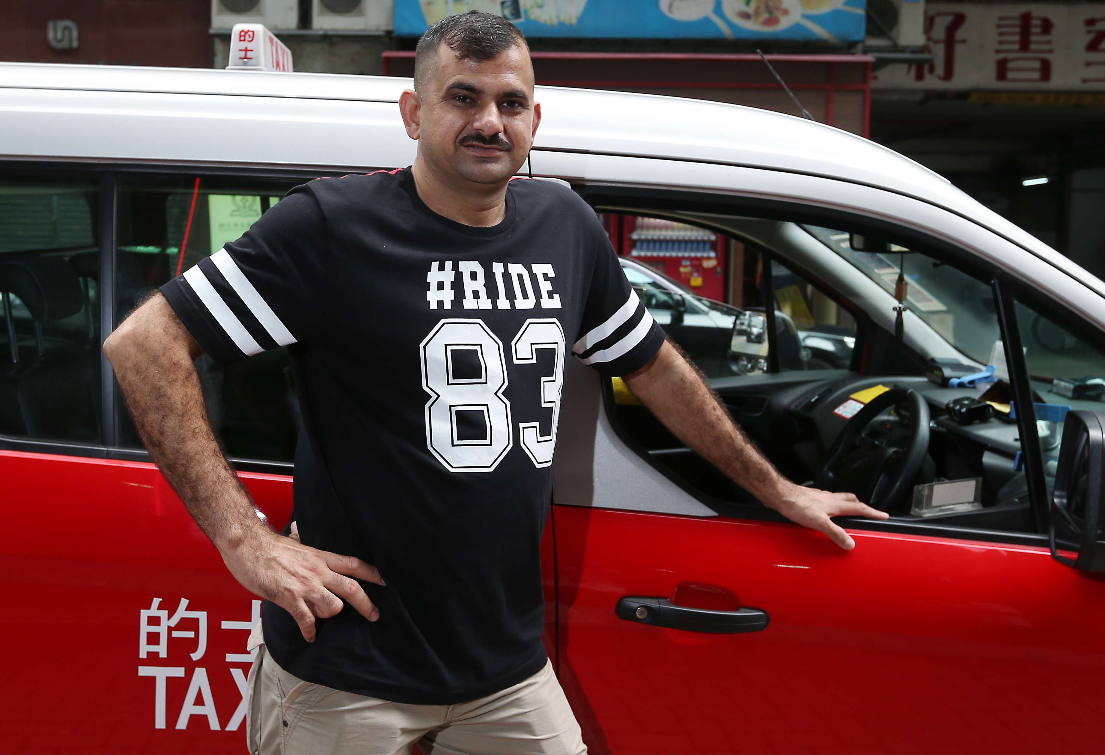 Shehzad Mamood Khan is Hong Kong's first ethnic minority taxi driver. Photo: K. Y. Cheng