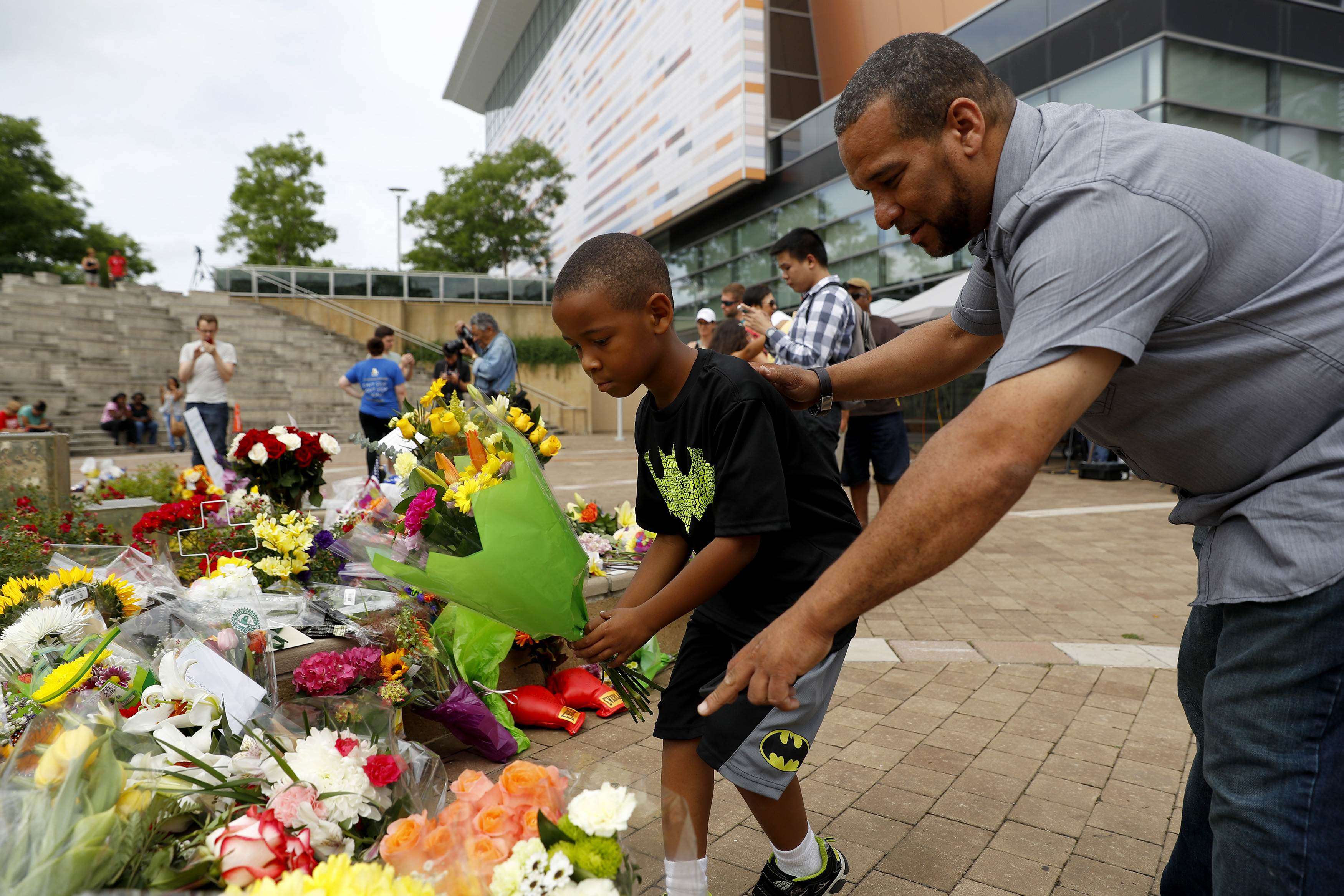 Mourners leave flowers at a memorial following the death of boxing legend Muhammad Ali. Photo: AFP