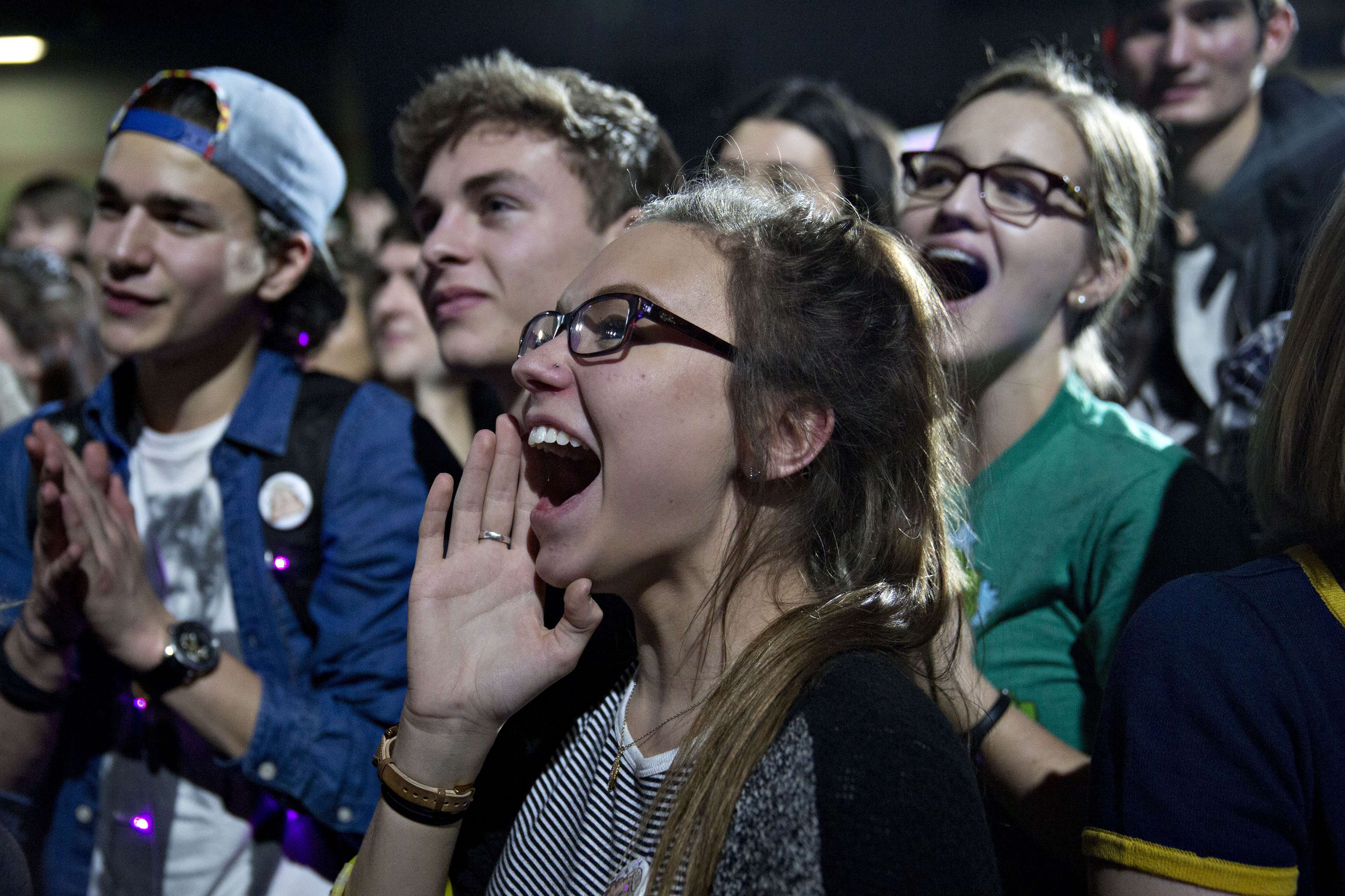 Young supporters of US Democratic presidential candidate Bernie Sanders cheer as he leaves the stage during a campaign rally at the University of Iowa Field House in Iowa City. Photo: Bloomberg
