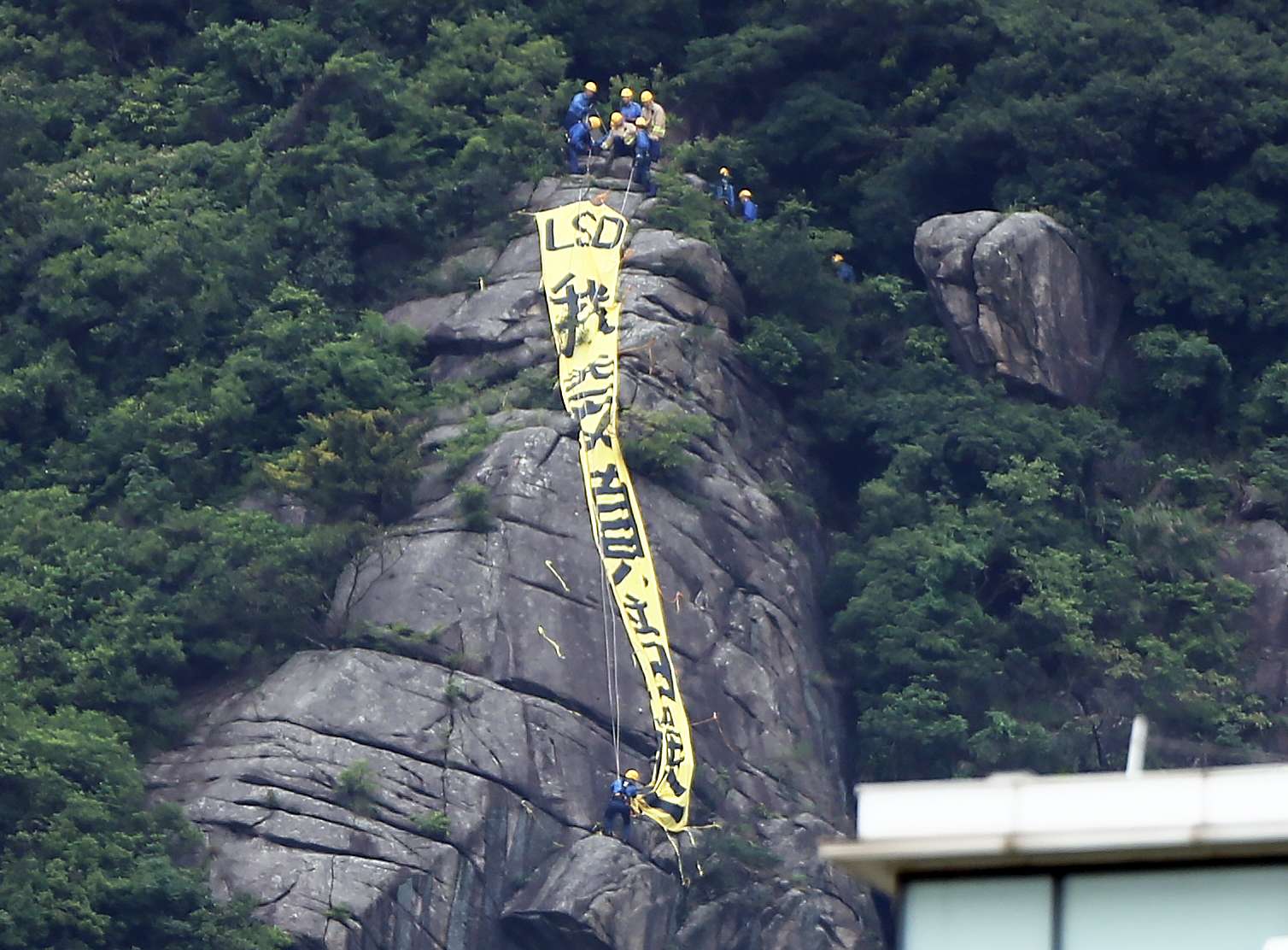 The offending democracy banner put up on Beacon Hill raises questions of law. Photo: Sam Tsang