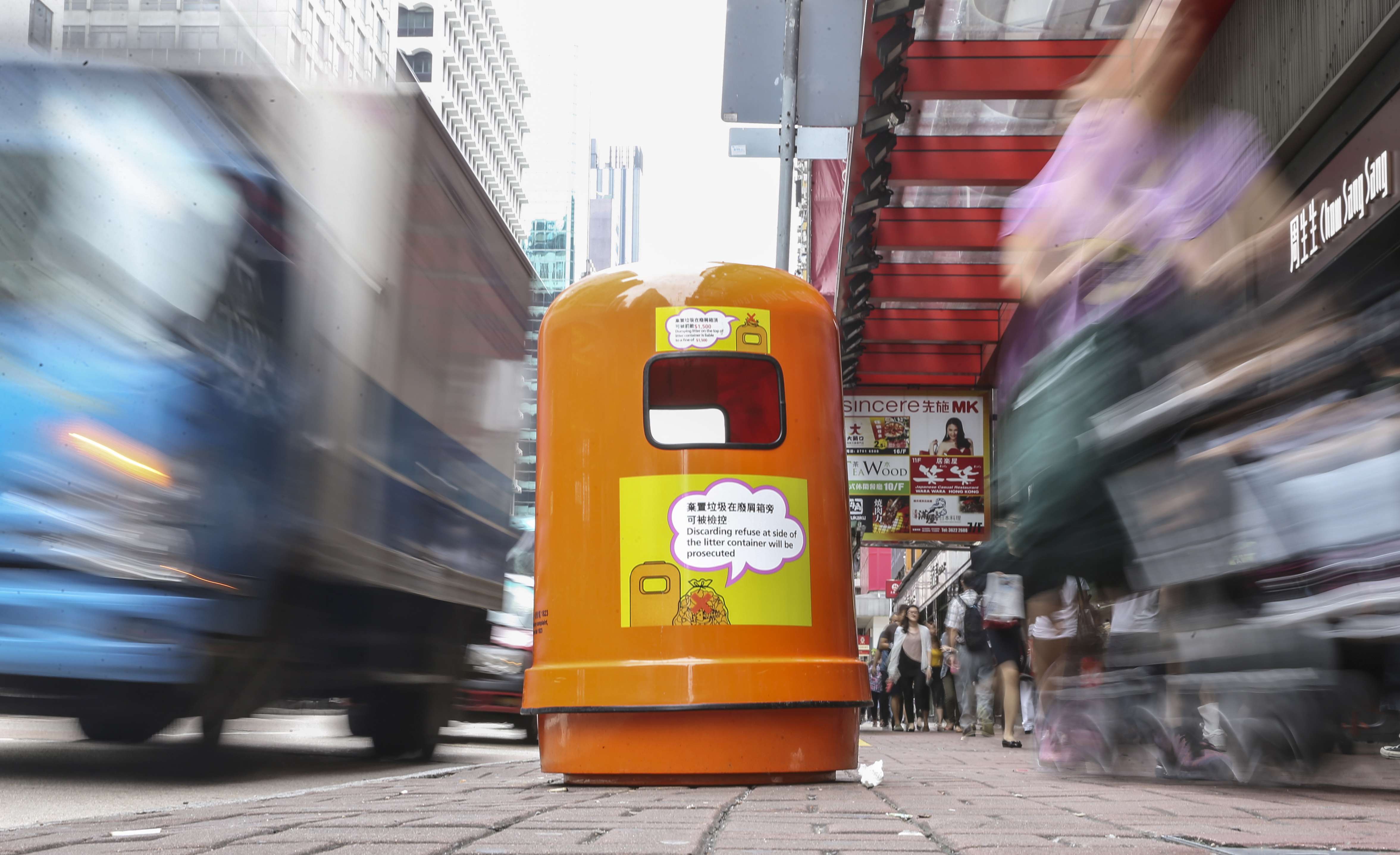 The newly designed rubbish bin featuring smaller openings and larger warning notices. Photo: Sam Tsang