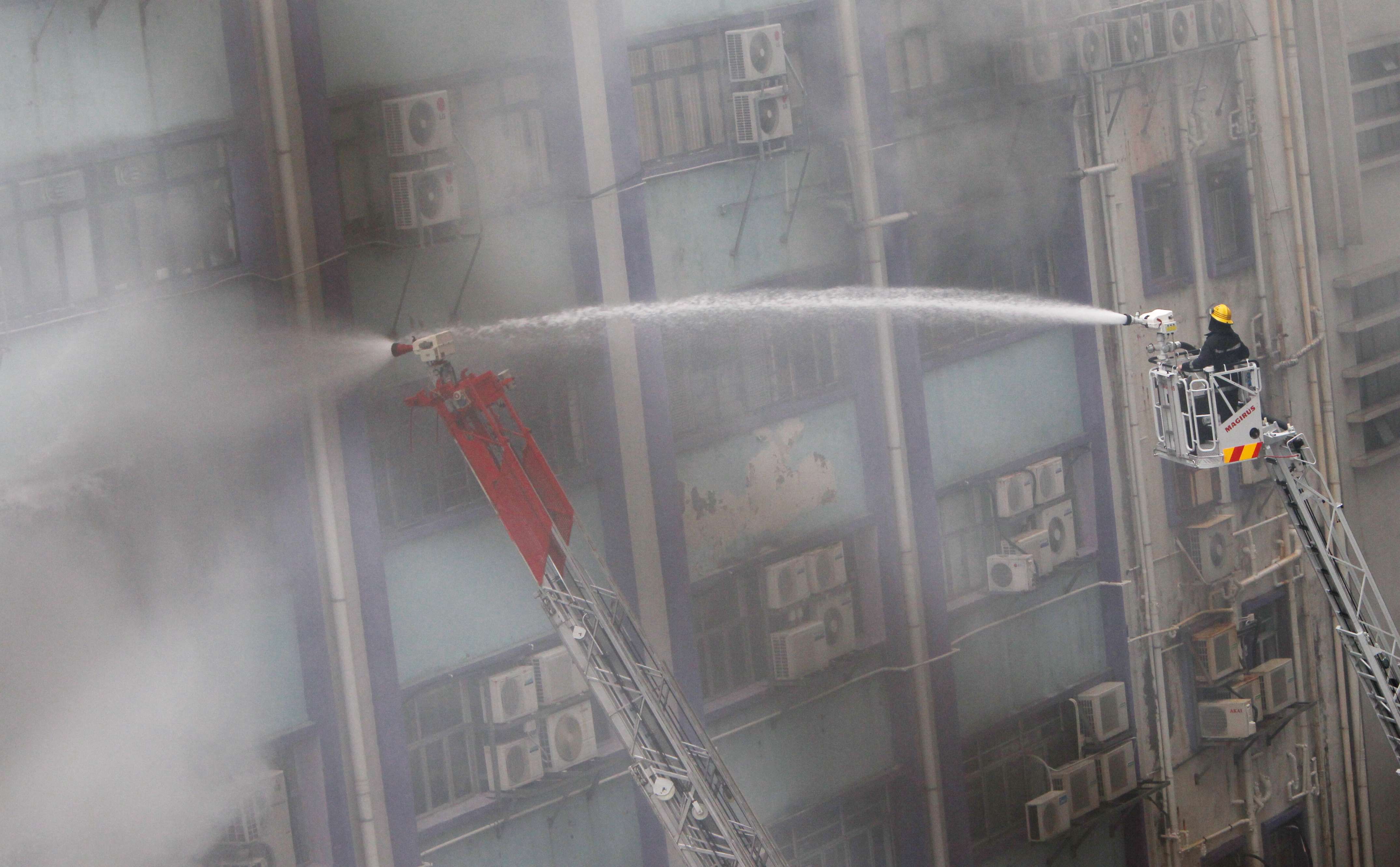 Firemen fight the blaze in Cheung Sha Wan in March 2010. Photo: David Wong