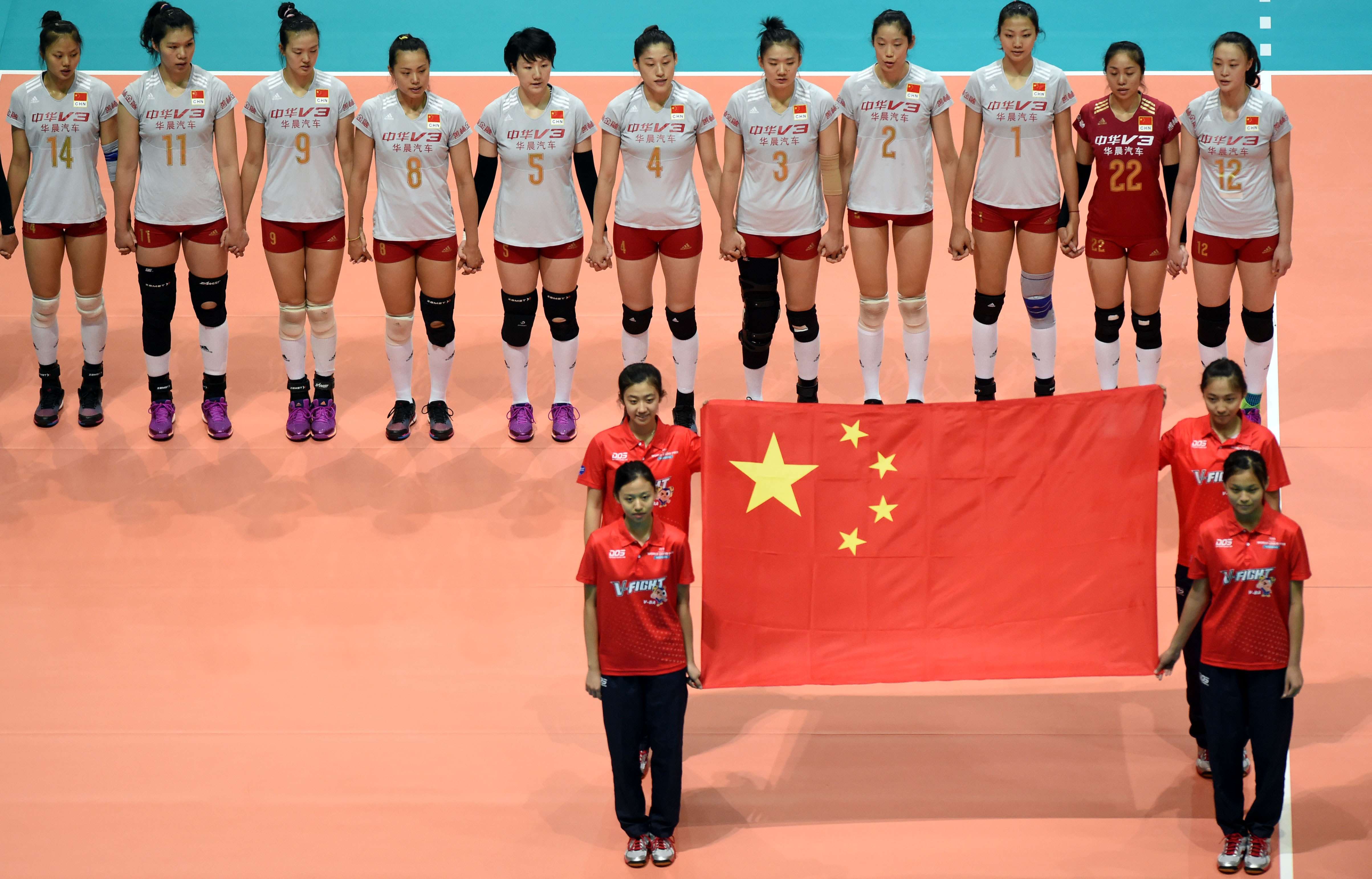 China players wait as the national anthem is played before their match against Germany. Photos: Xinhua