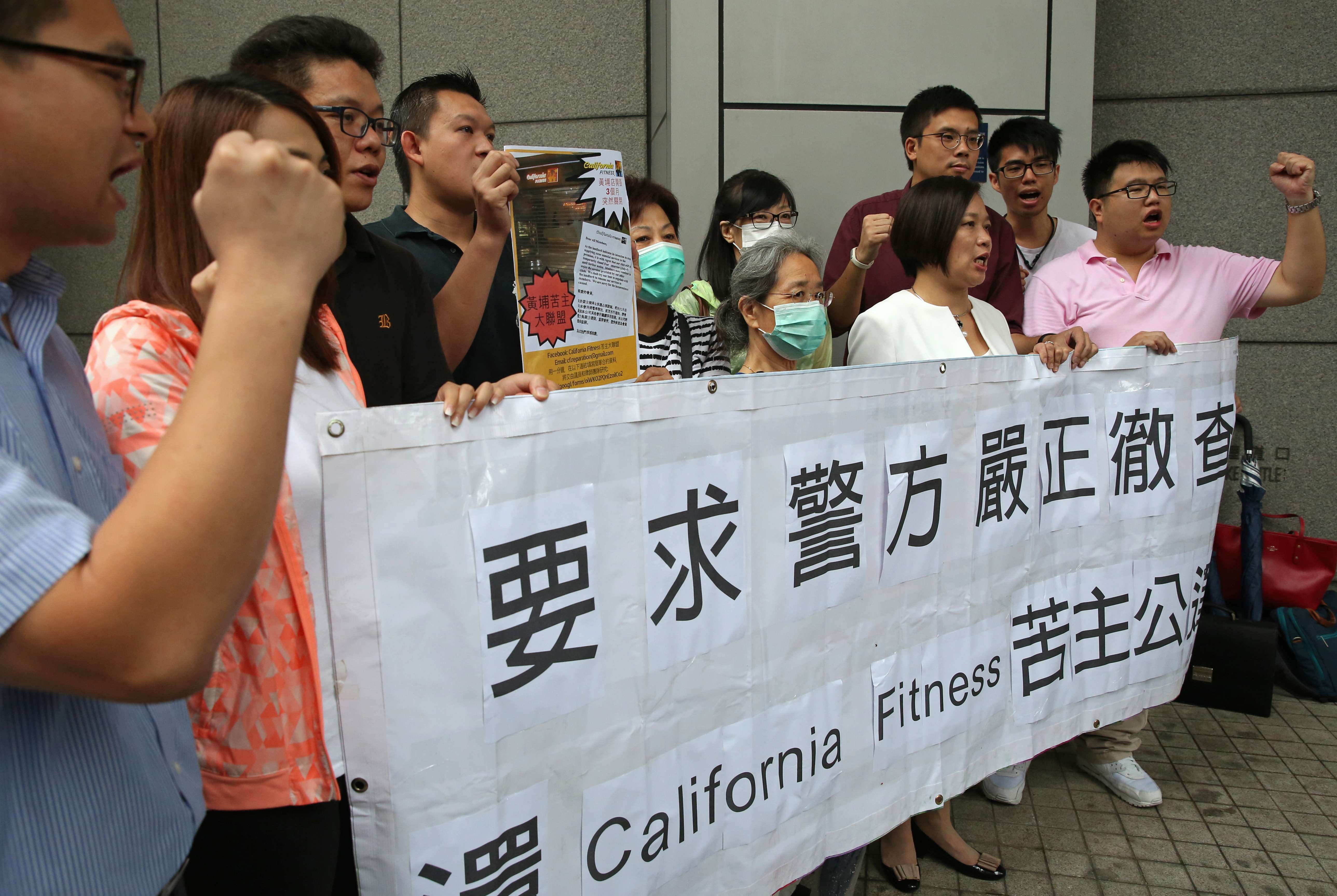 California Fitness customers with lawmaker Dr Priscilla Leung Mei-fun (front row, second from right) demanding an investigate the gym, at police headquarters in Wan Chai on Wednesday. Photo: Sam Tsang