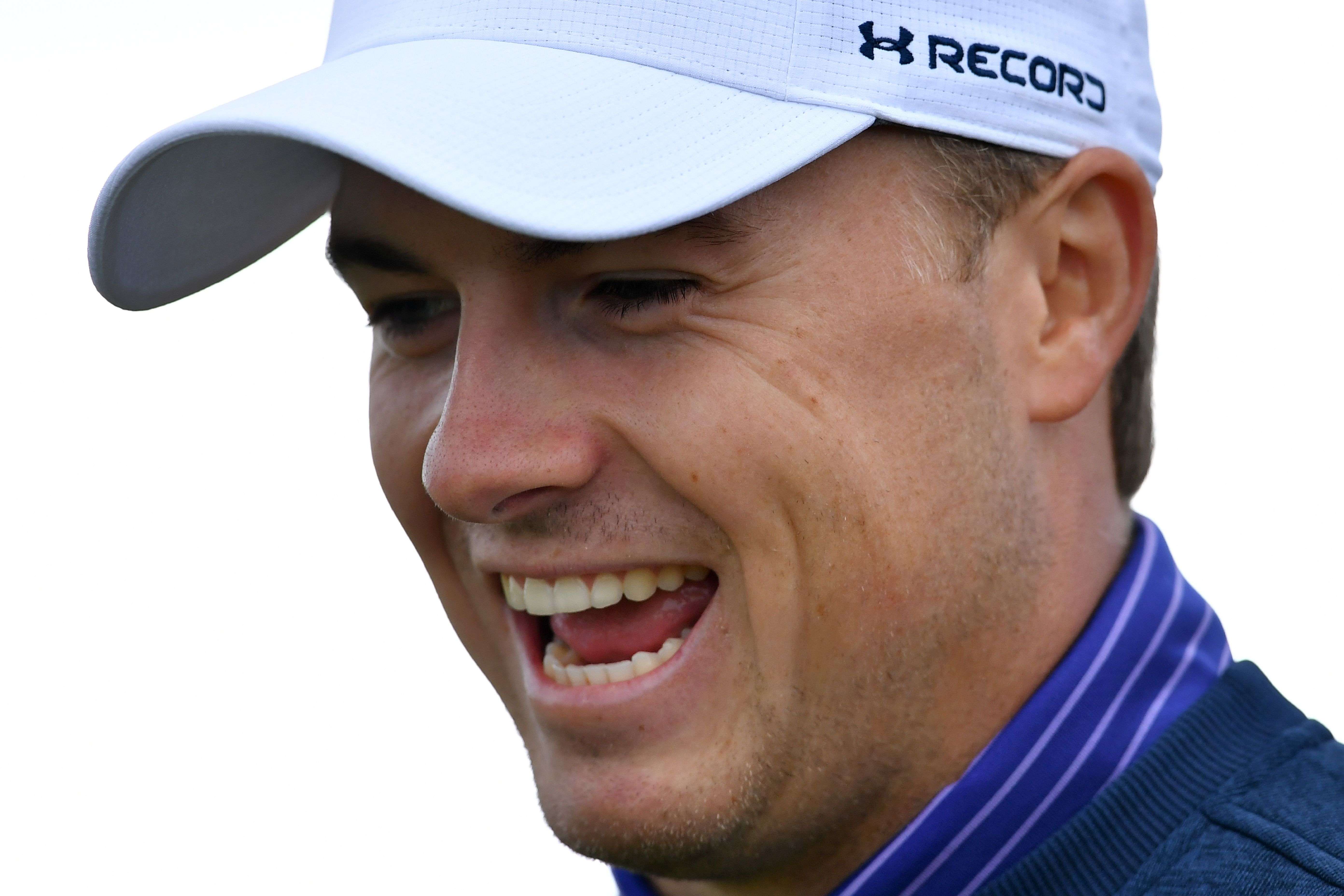 US golfer Jordan Spieth smiles as he leaves the 4th tee during practice on July 11, 2016, ahead of the 2016 British Open Golf Championship at Royal Troon in Scotland. AFP PHOTO / BEN STANSALL / RESTRICTED TO EDITORIAL USE