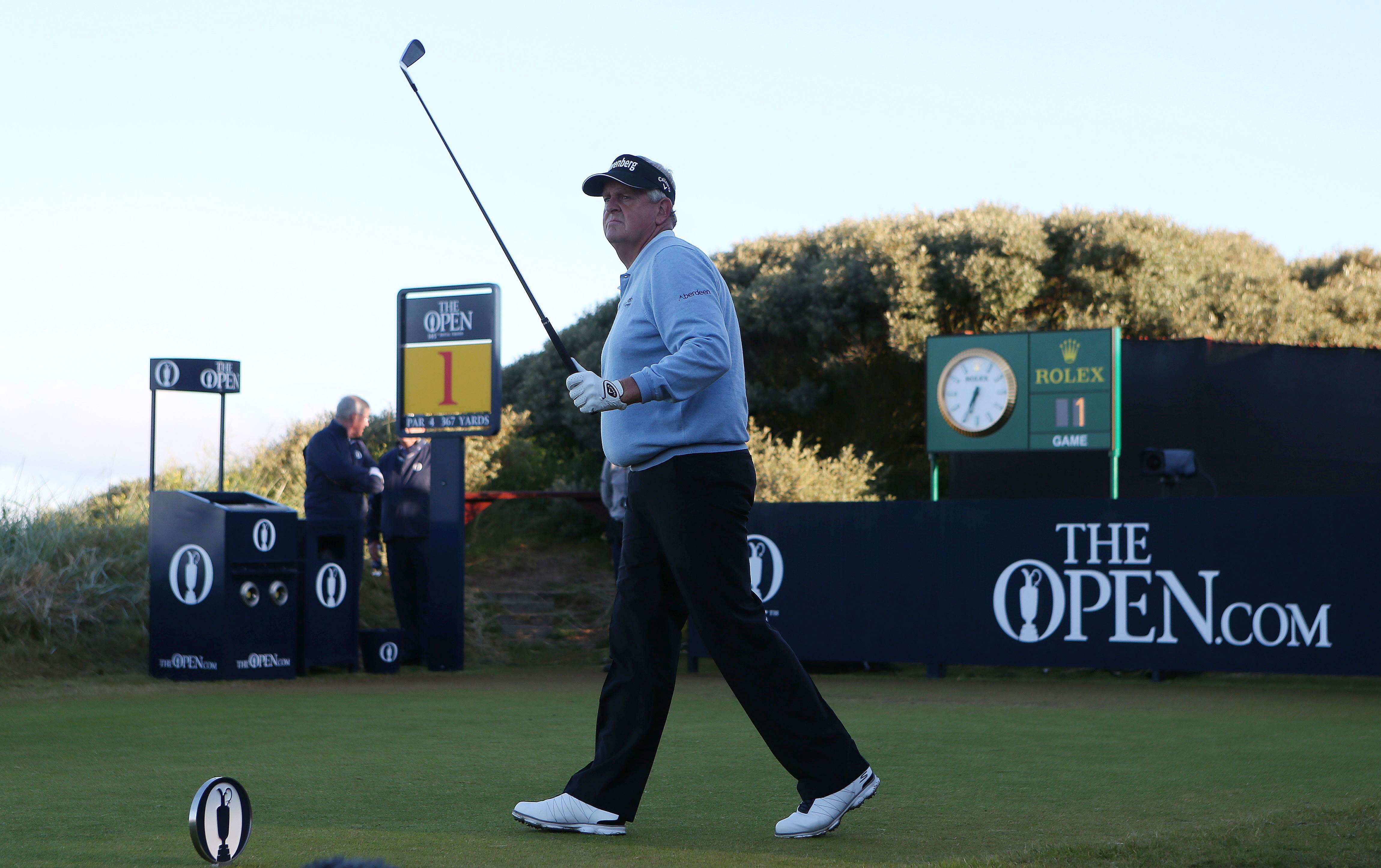 Scotland's Colin Montgomerie walks off the first tee at Royal Troon after playing the opening shot of the British Open. Photo: Reuters