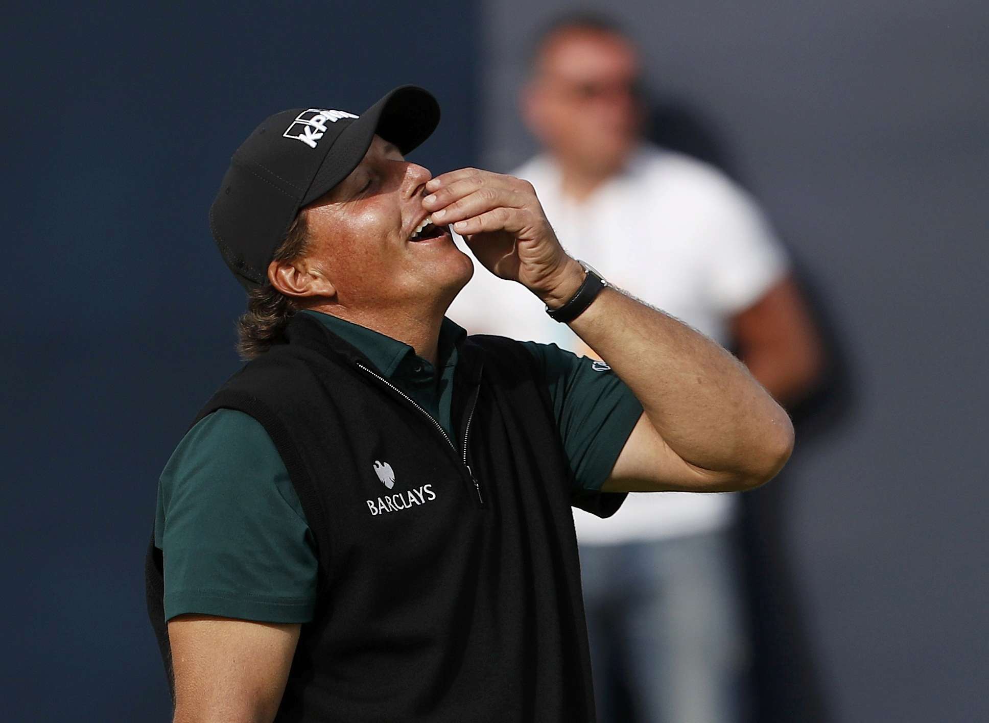 Phil Mickelson reacts after missing a birdie putt on the 18th green that would have broken a majors scoring record. Photo: Reuters