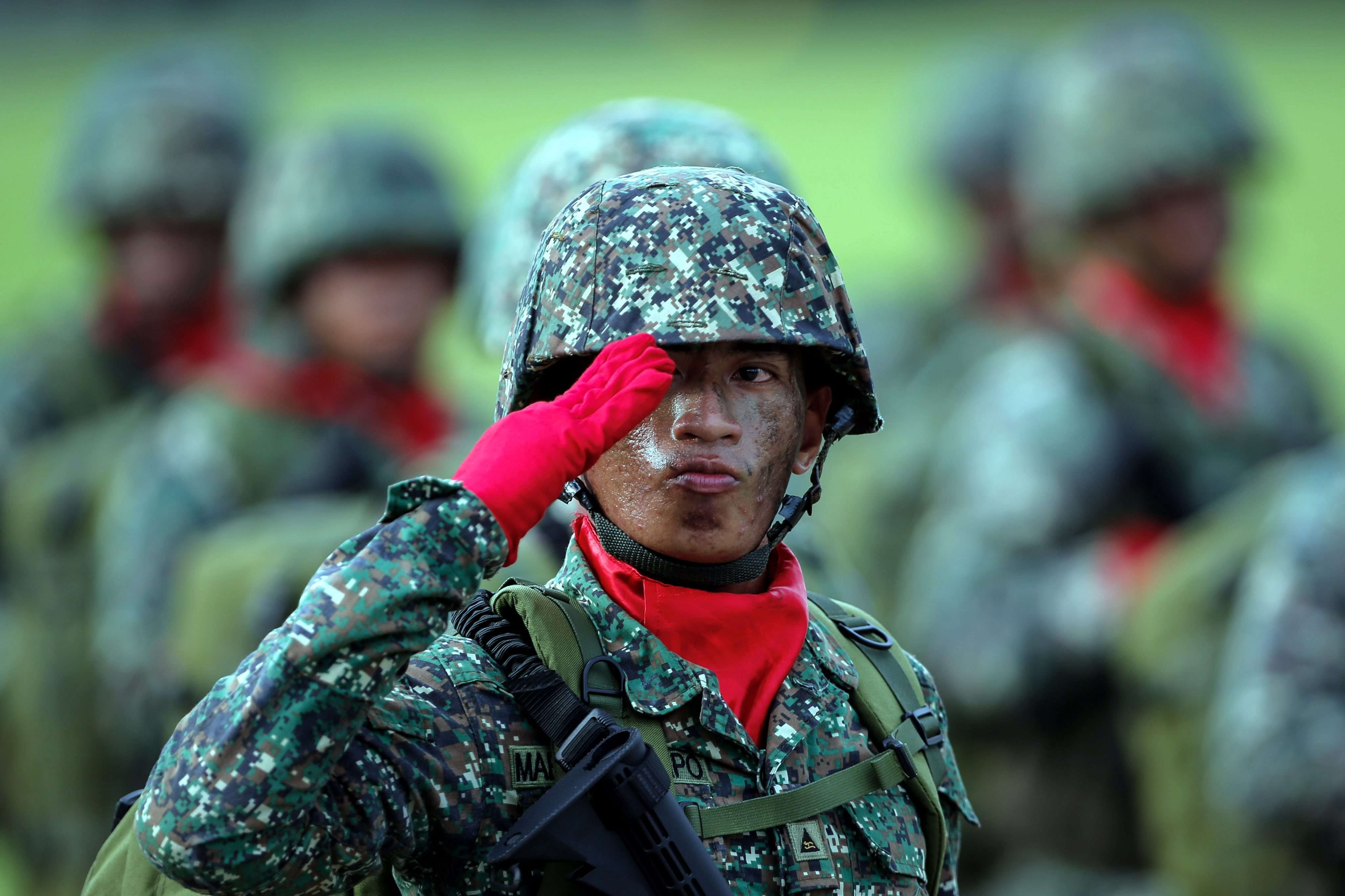 A Filipino soldier salutes during a parade. The Philippines is beefing up its military with the procurement of fighter jets from South Korea. Photo: EPA