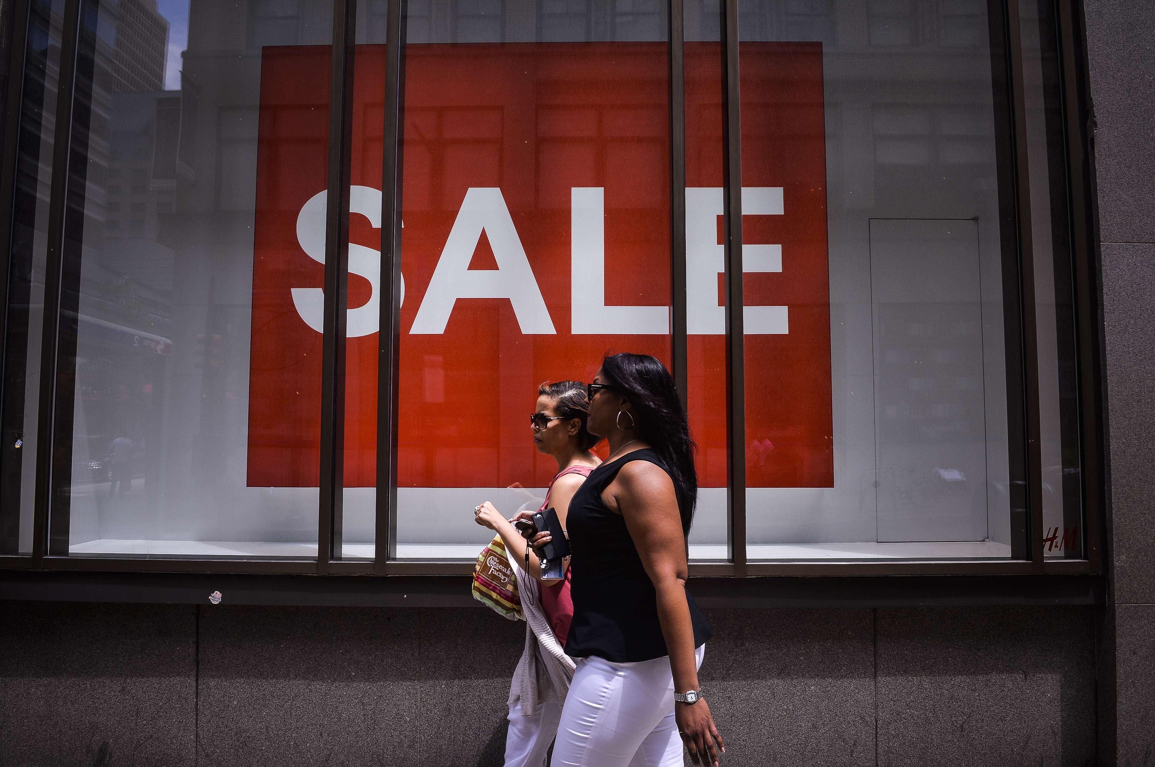 Pedestrians walk past an H&M clothing store in Philadelphia, Pennsylvania. Photo: Bloomberg
