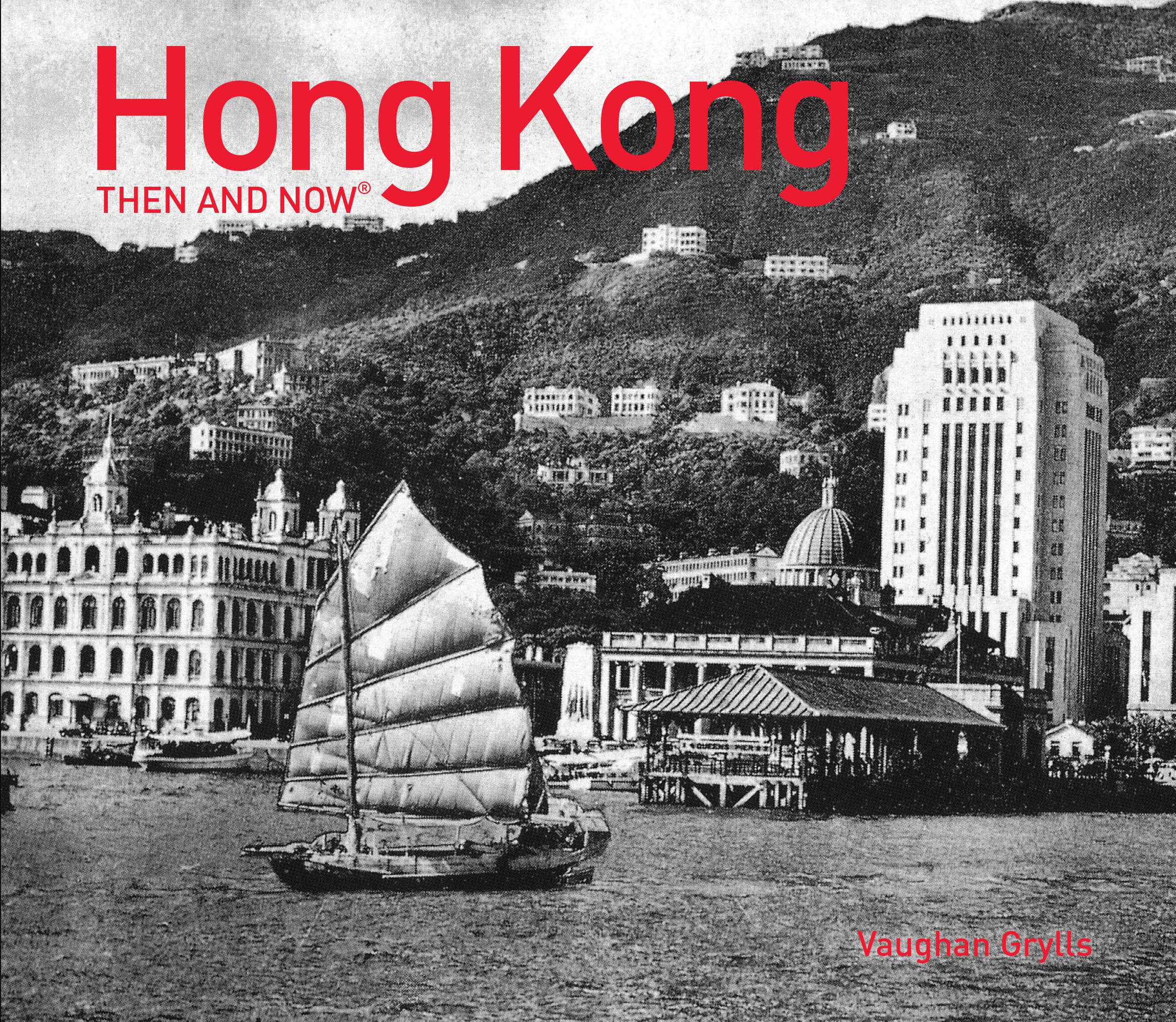 A scene from about 1952 of Central as a Chinese junk passes Victoria Harbour ferry terminal on Hong Kong Island, taken from the new book, Hong Kong Then and Now. Photo: Getty/Pavilion Books