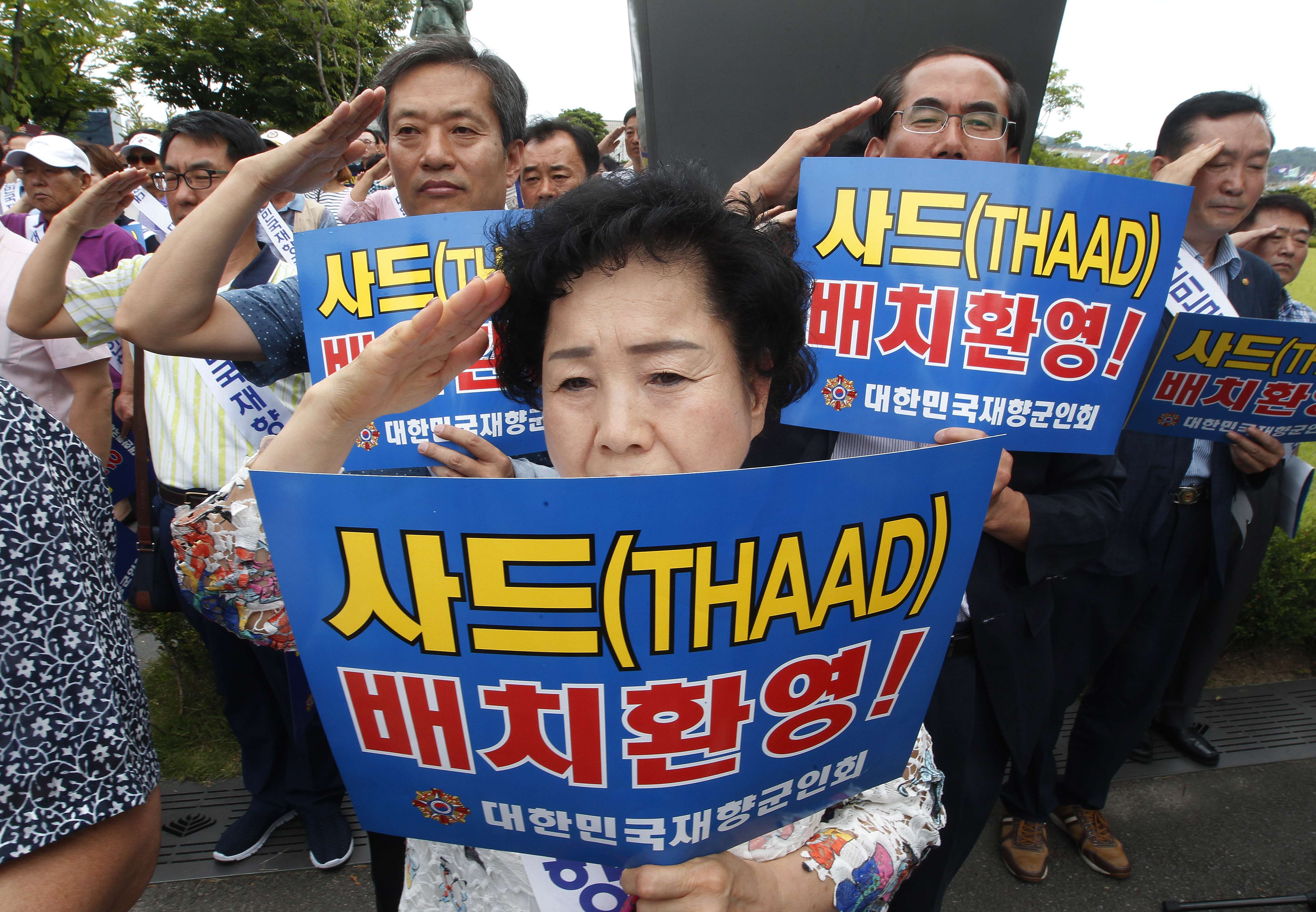 Members of the Korean Veterans Association salute during a rally in Seoul to support a deployment of Thaad. The advanced US missile defence system will be deployed in a rural town in southeast South Korea. Photo: AP