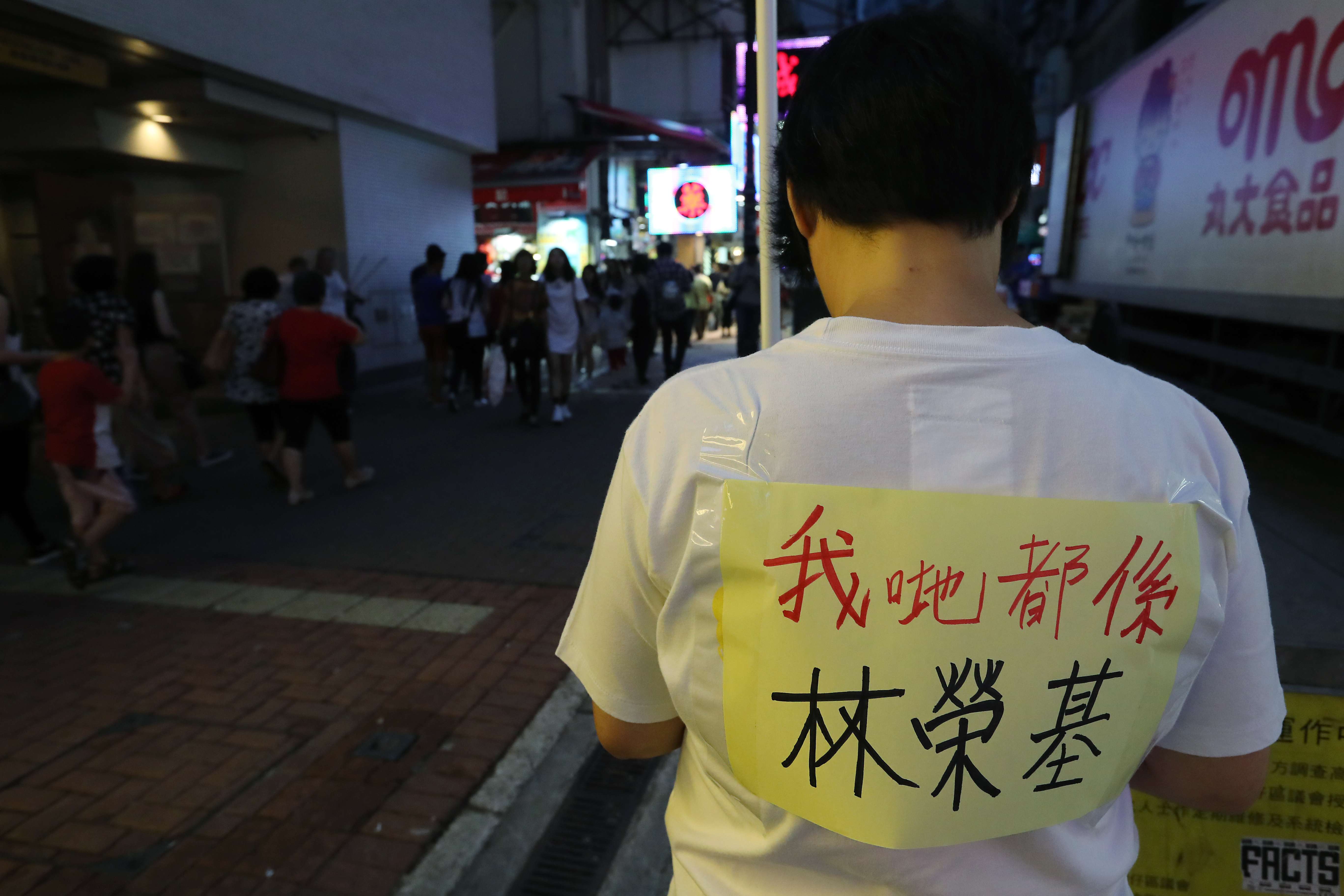 A member of Hong Kong’s Labour Party protests near Causeway Bay Books to support Lam Wing-kee, one of the five booksellers detained on the mainland. The sign he wears says “We’re all Lam Wing-kee”. Photo: Edward Wong
