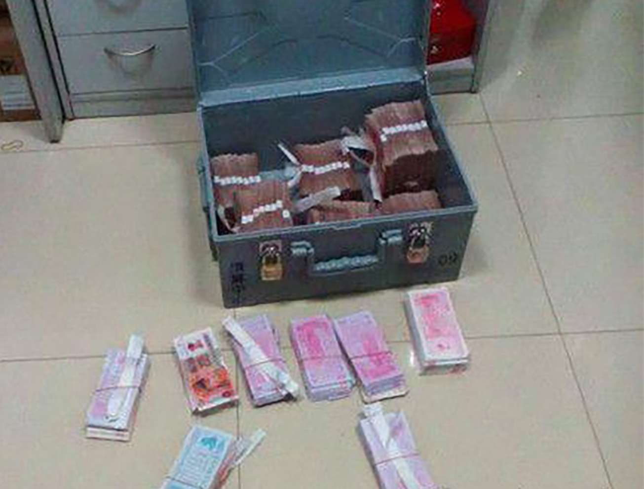A bank clerk replaced cash he stole with “spirit money”, at front. Photo: SCMP Pictures