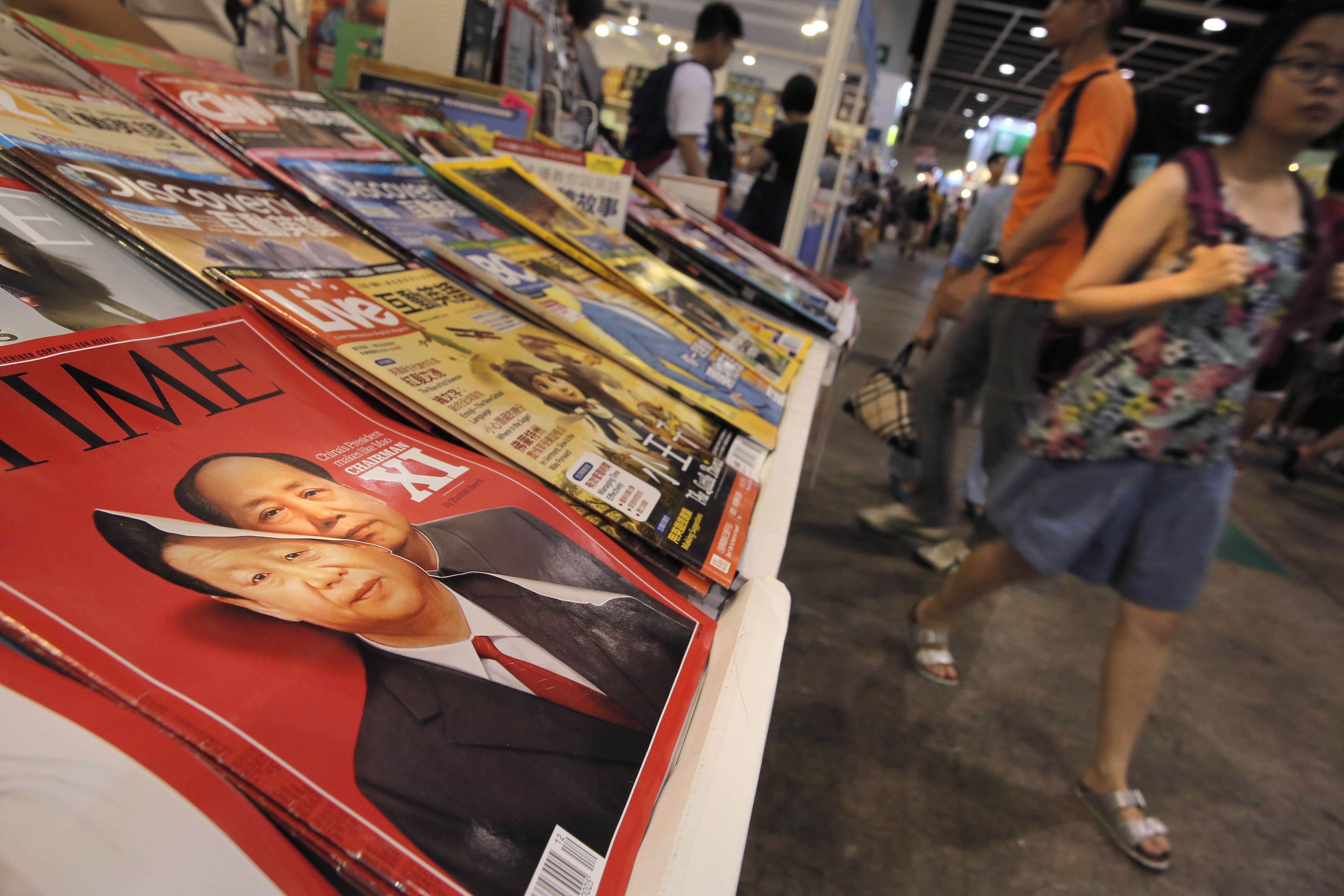 An April 2016 issue of Time magazine that features portraits of Xi Jinping and Mao Zedong on its cover is displayed at the Hong Kong Book Fair last month. Photo: AP