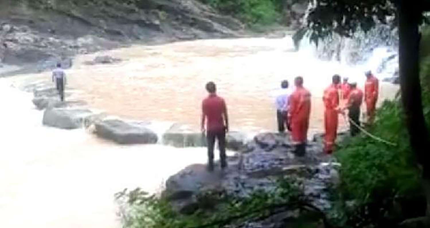Rescue workers search for two tourists who were swept away by a flash flood. Photo: SCMP Pictures