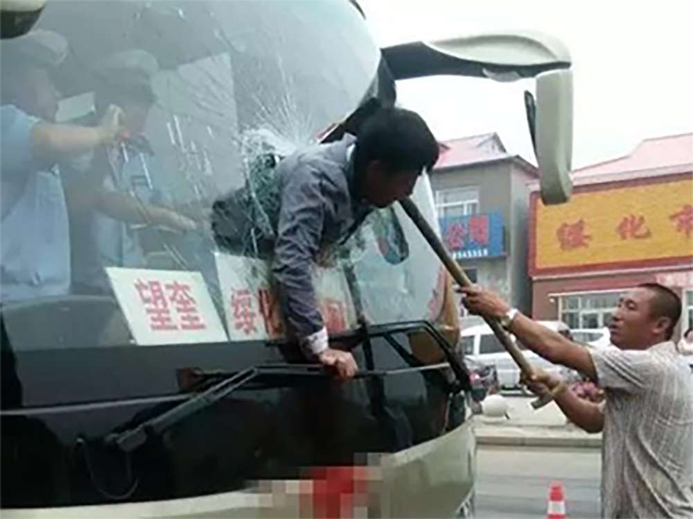 A man was propelled through a bus window when the driver braked suddenly. Photo: SCMP Pictures