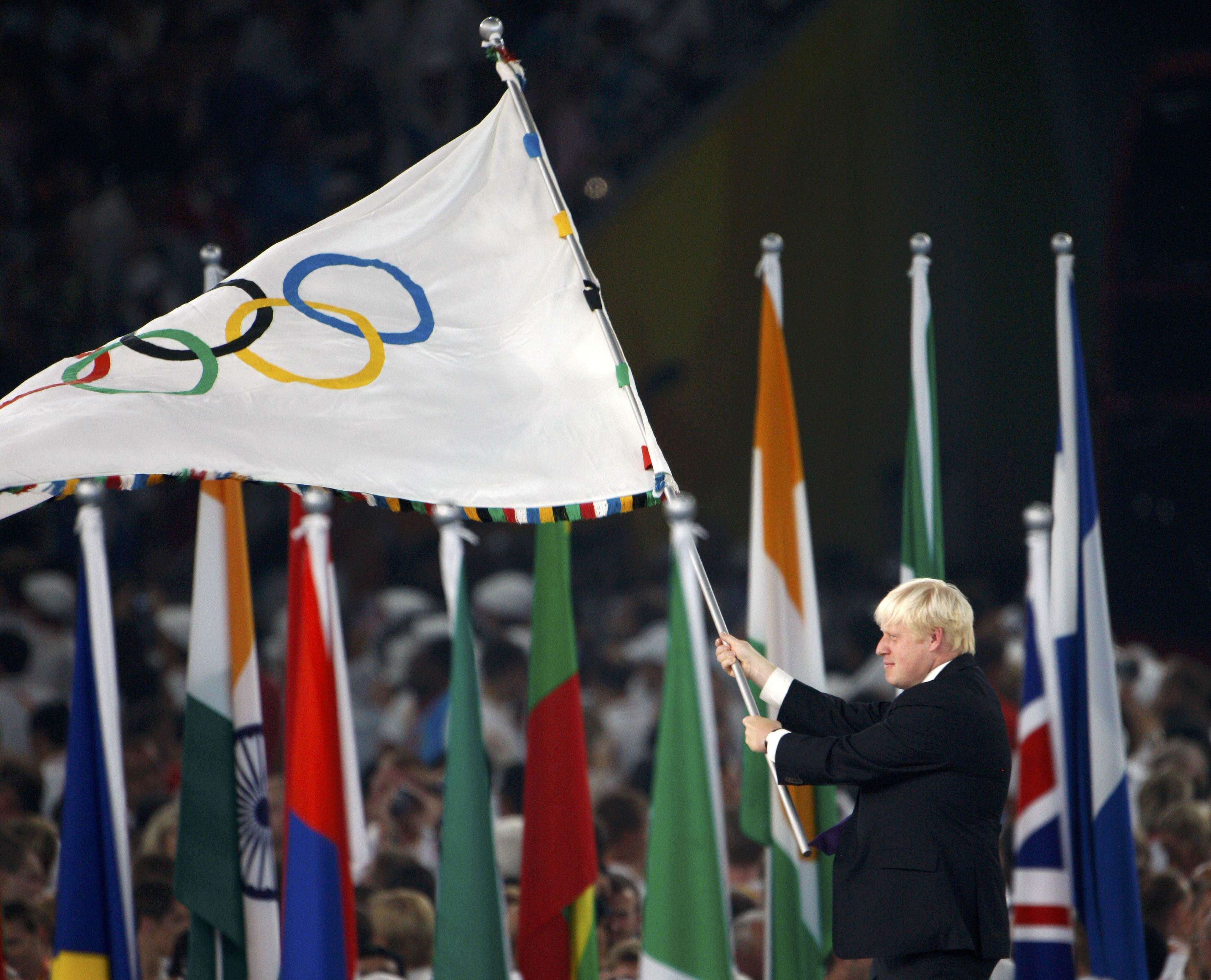 Then London mayor Boris Johnson waves the Olympic flag during the closing ceremony in the National Stadium at the 2008 Olympic Games in Beijing. Photo: Reuters