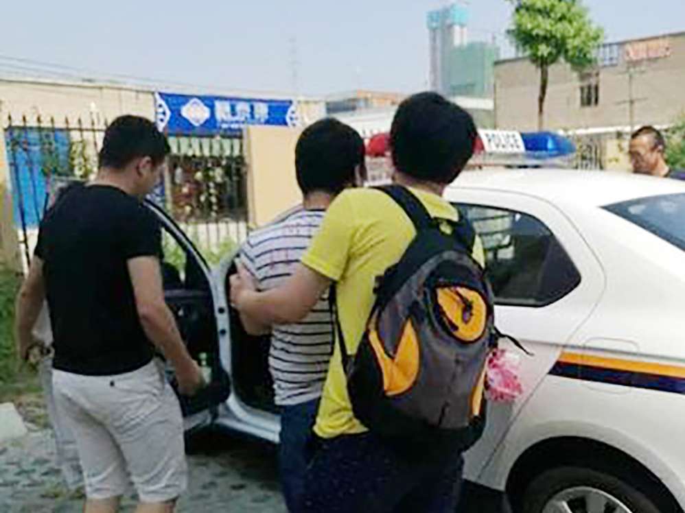 Police arrest a man for the theft. Photo: SCMP Pictures