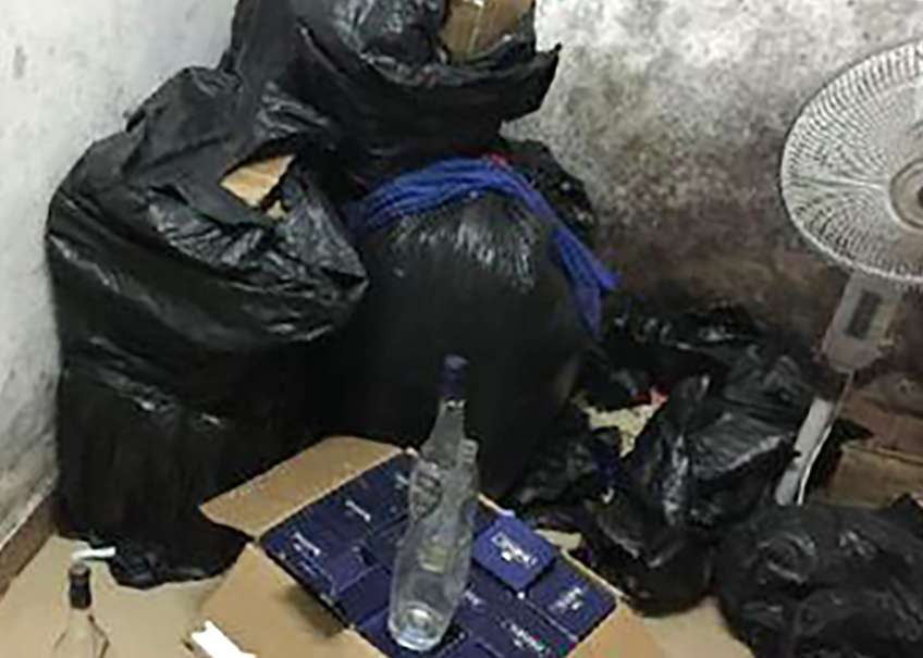 Guanzhou police arrested three men for selling fake alcohol. Photo: SCMP Pictures