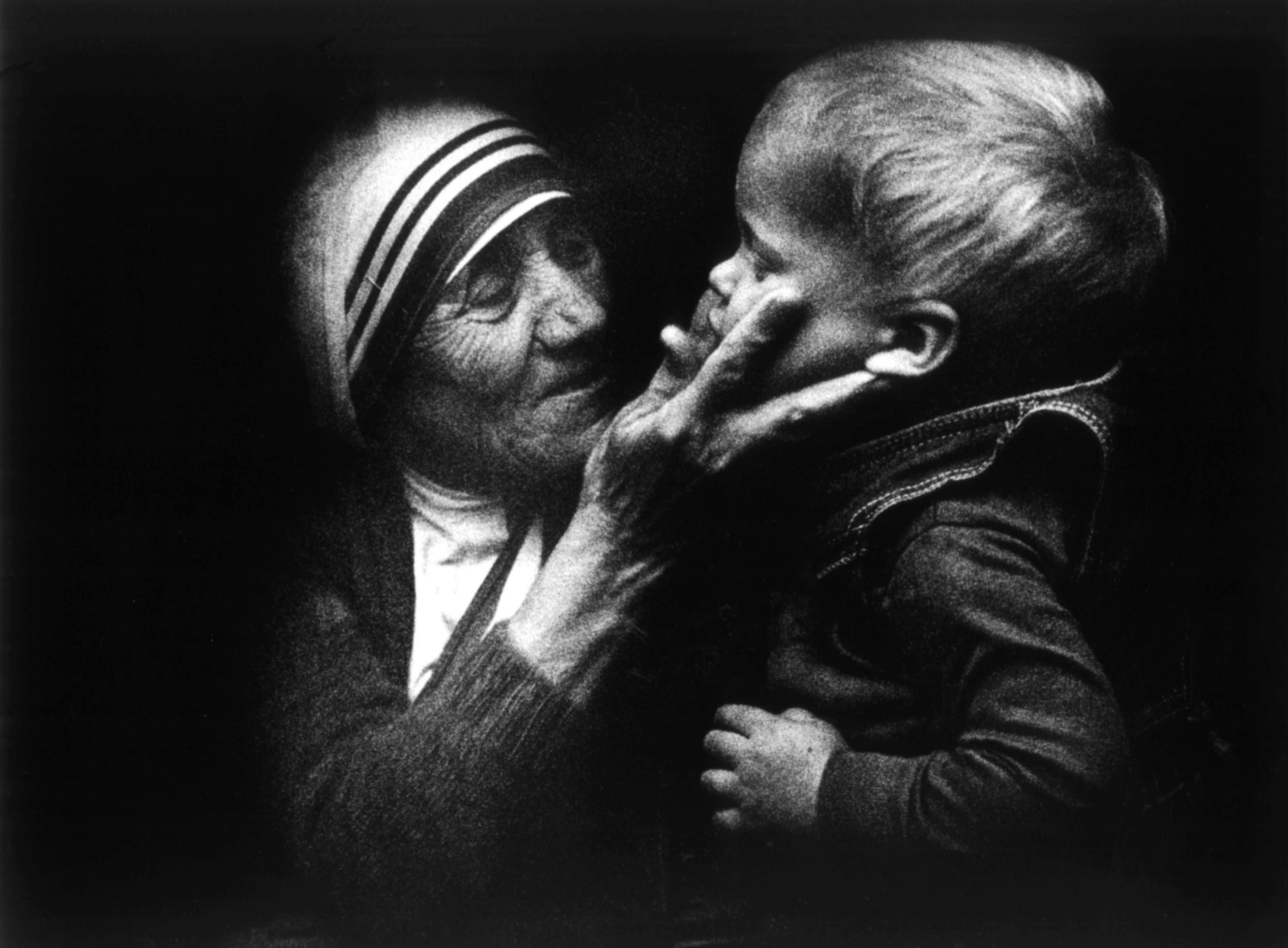 Mother Teresa from Calcutta, holds a Polish child during a visit to Poland. Photo: EPA