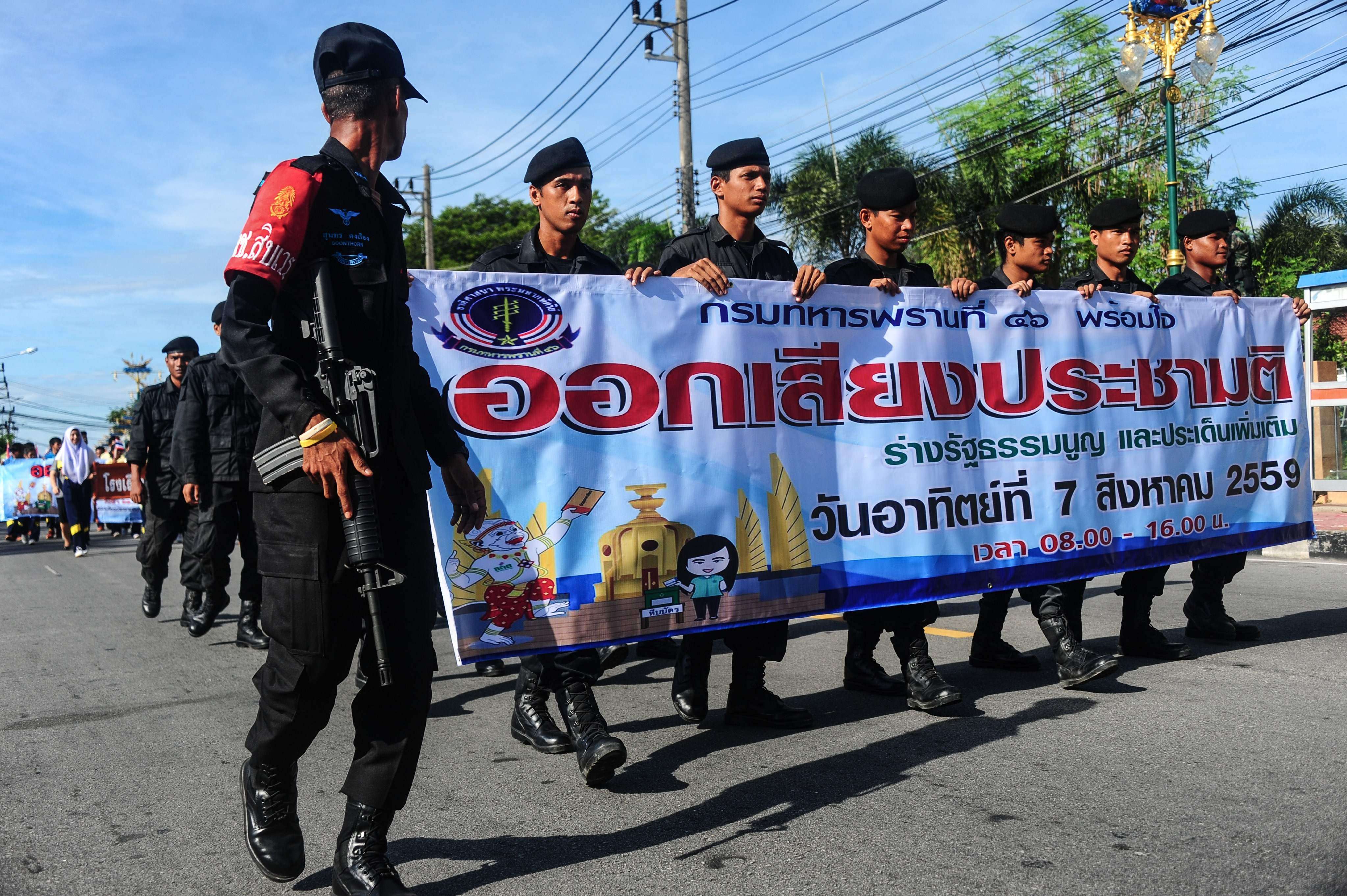 Thai soldiers march as part of a campaign encouraging the public to vote in the referendum on Thailand's draft constitution. Photo: AFP