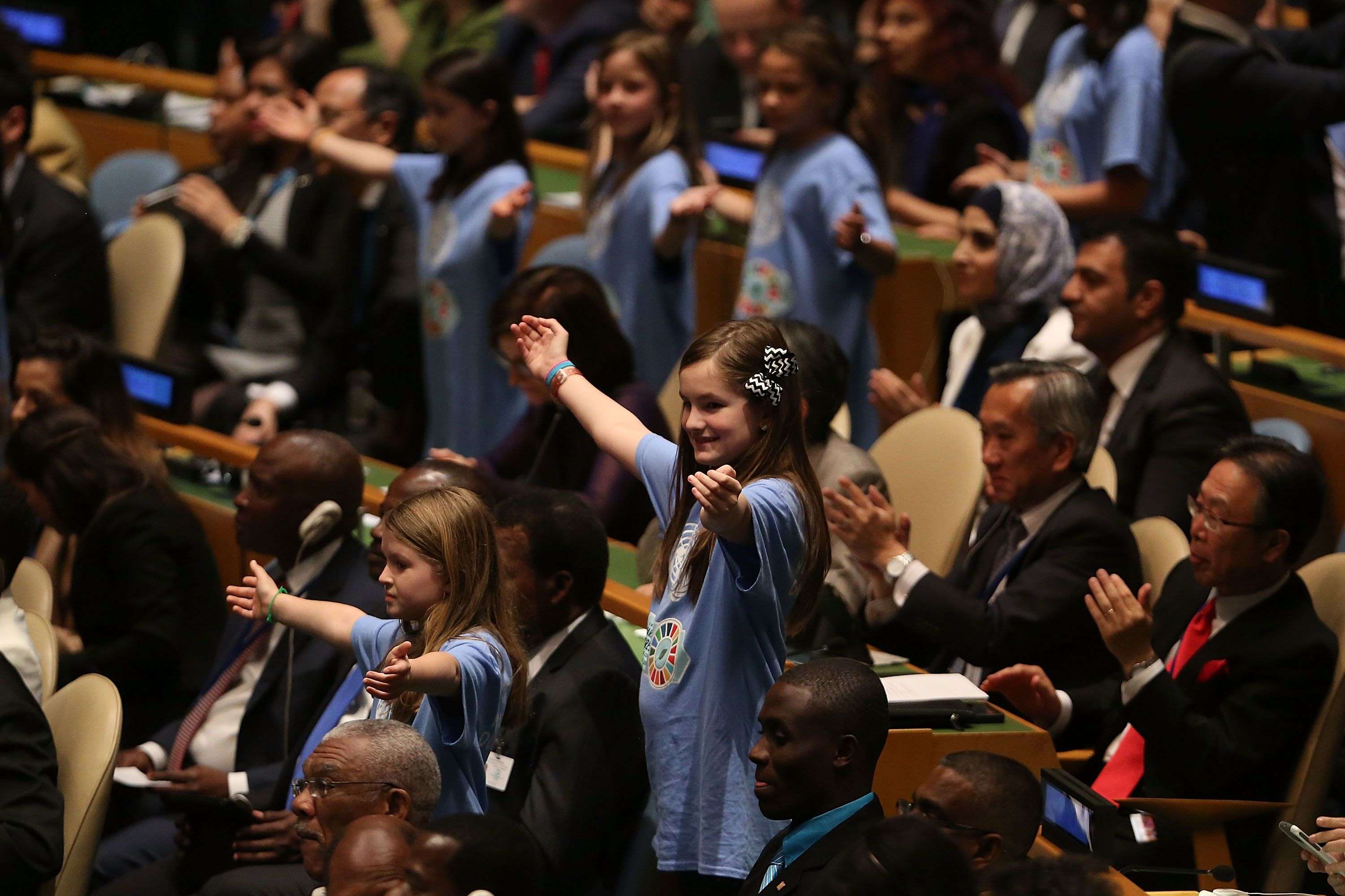 Children from around the world stand with leaders and country delegates in the General Assembly Hall at the UN signing ceremony for the Paris Agreement on April 22 in New York City. Photo: AFP