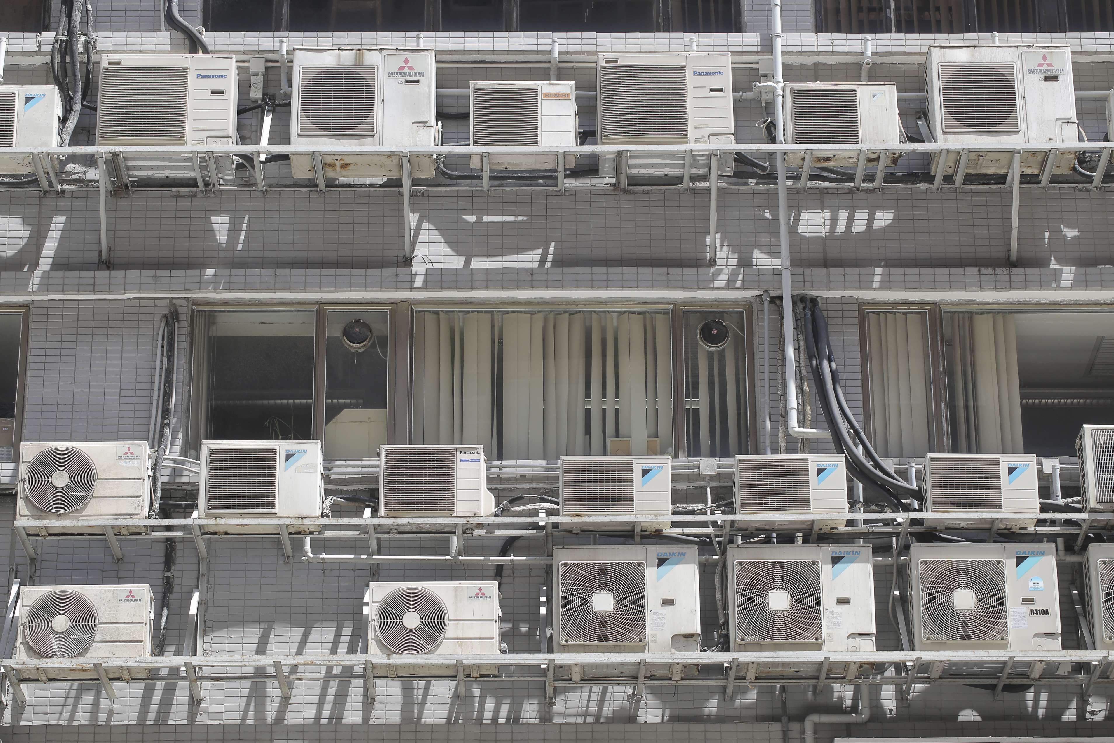 Air-con units outside an industrial building in Lai Chi Kok. Photo: Paul Yeung
