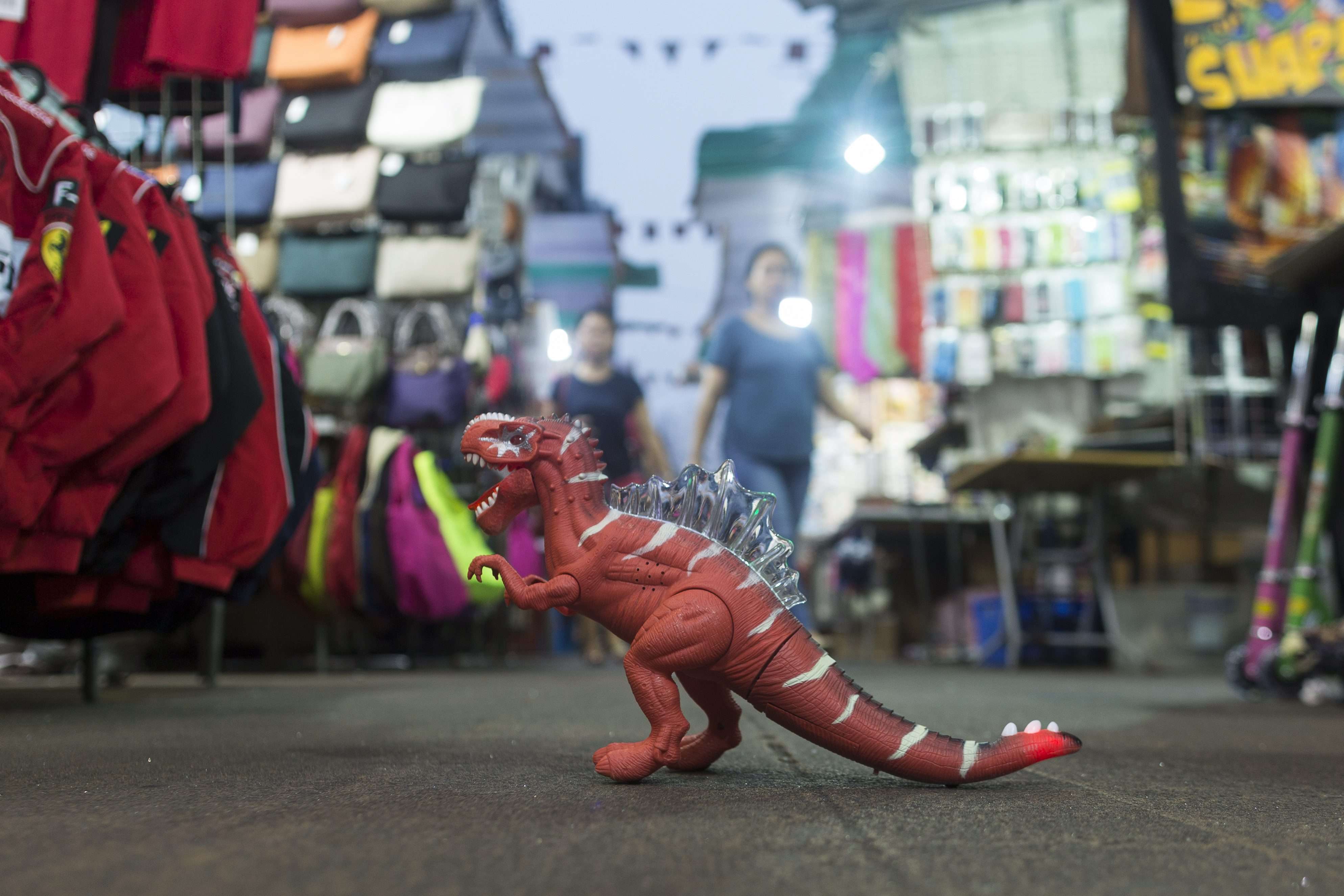 A toy dinosaur for sale at Hong Kong’s Temple Street night market. When Hong Kong’s economic growth hits a wall, the government must lead to invest in our future. Photo: EPA