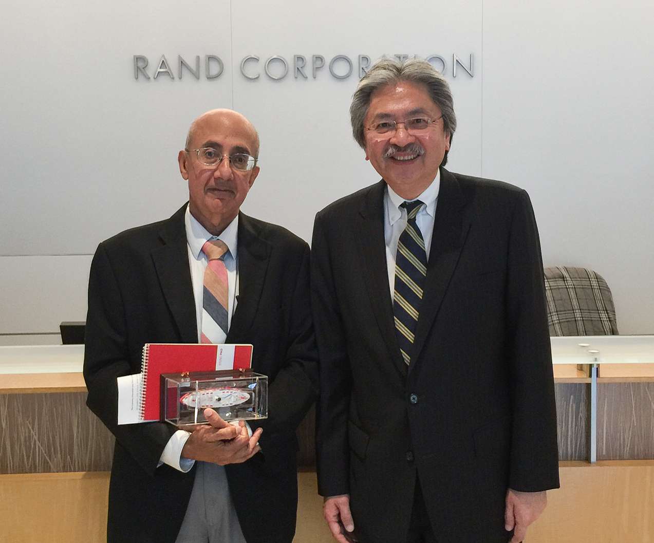 John Tsang with Rafiq Dossani (left), director of the RAND Centre for Asia Pacific Policy, during a visit to the RAND Corporation, a think-tank in the US. Photo: SCMP Pictures