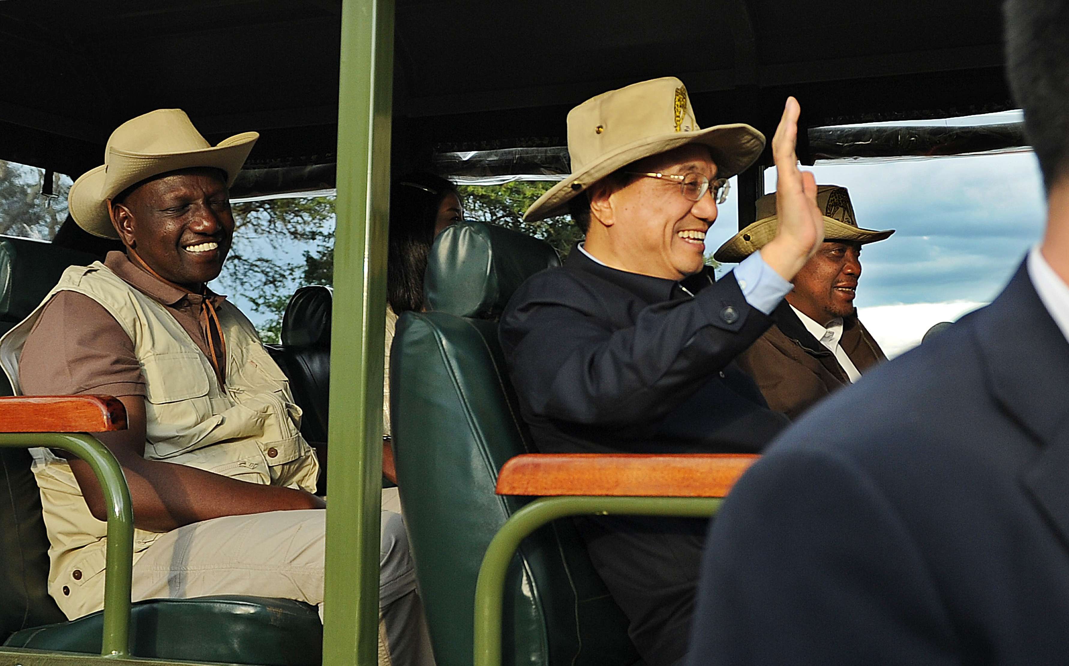 Chinese Prime Minister Li Keqiang rides in a customised game-viewing vehicle with Kenyan President, Uhuru Kenyatta, right, and his vice-President, William Ruto in May 2014 at the Nairobi national park. Kenya secured a loan to build the SGR line during the visit. Photo: AFP