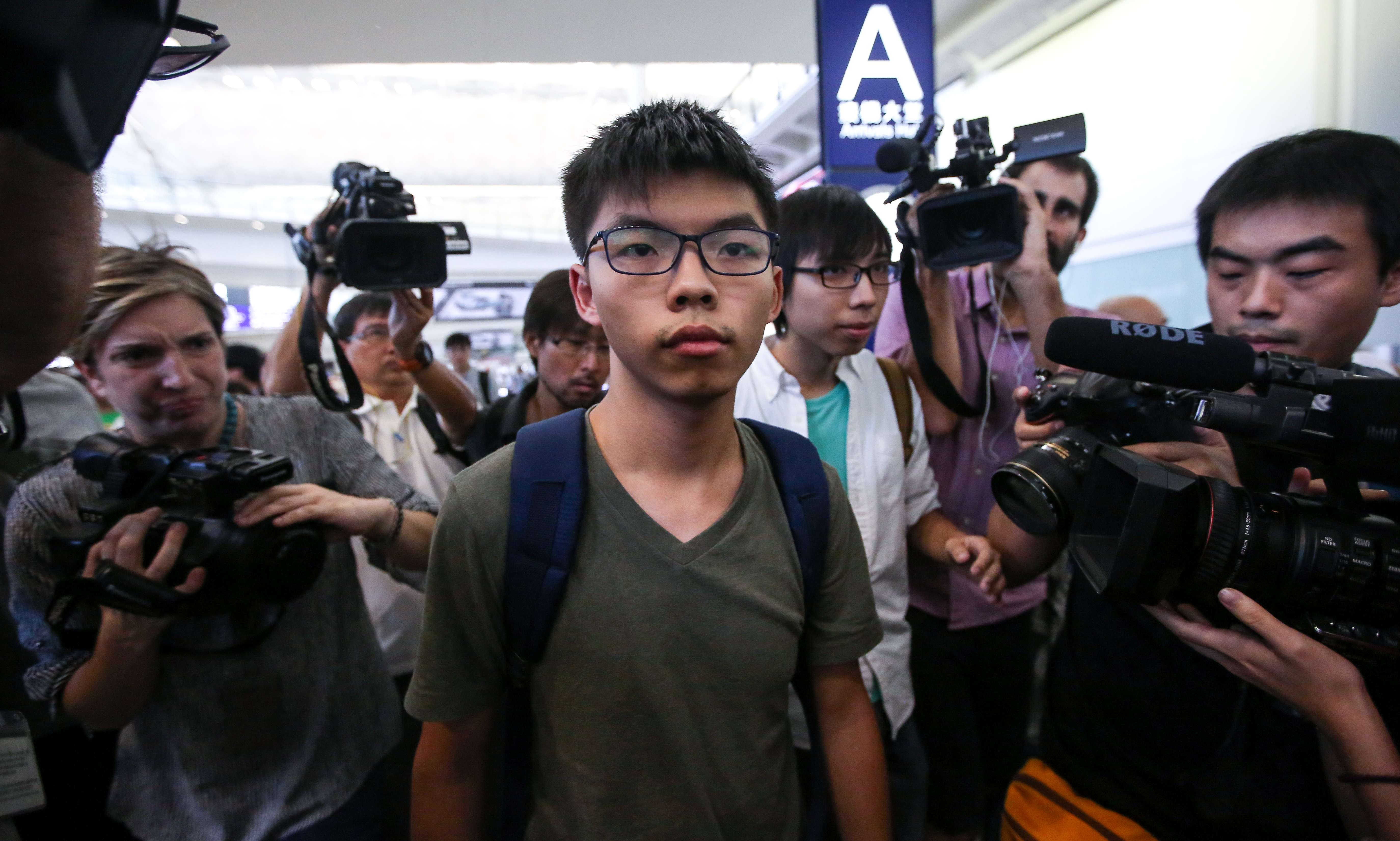 Activist Joshua Wong arrives at the Hong Kong International Airport after being detained by Thai authorities and denied entry to Thailand. Photo: Sam Tsang