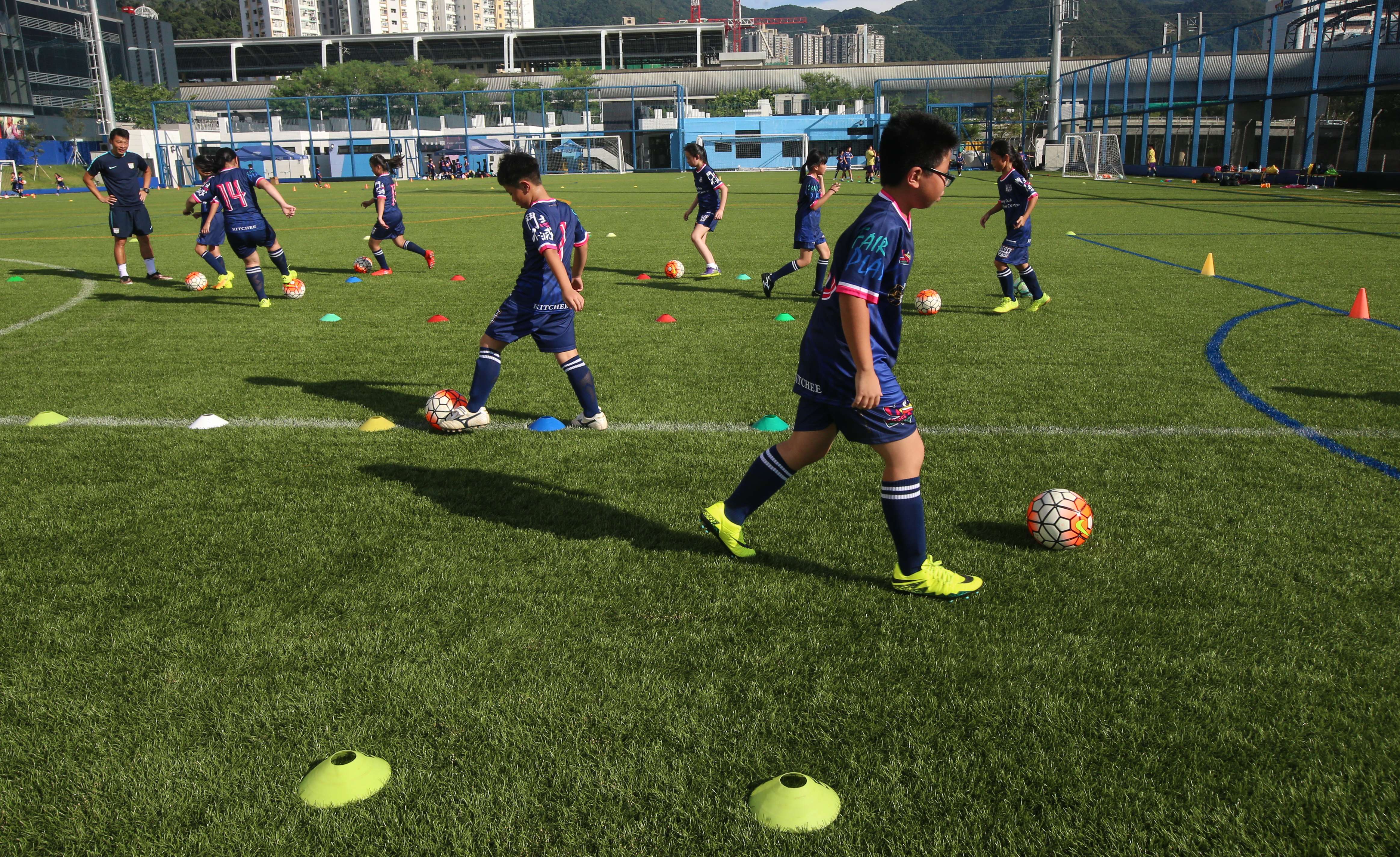 Children play football at the Kitchee sports centre in Sha Tin on October 4. The HK$84 million training centre is barely a year old. Photo: David Wong