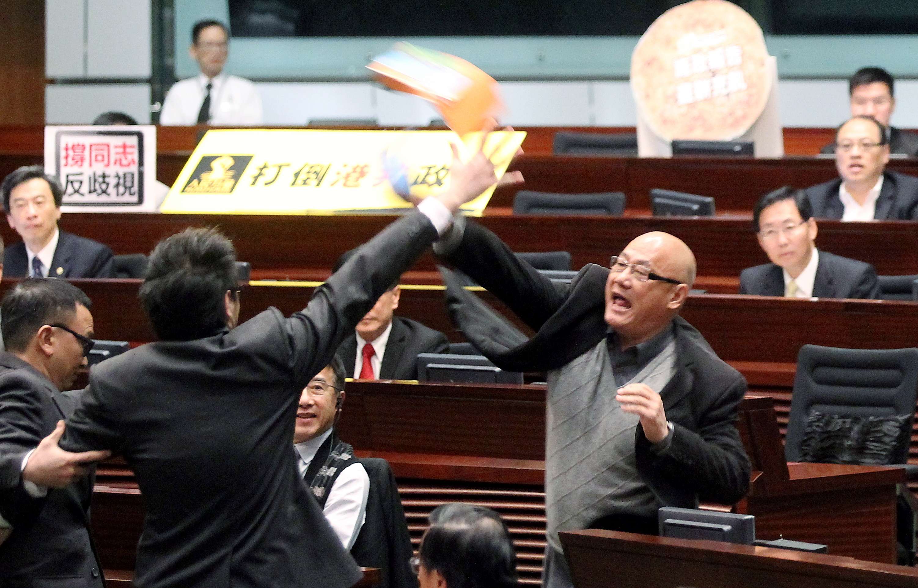 The frequent protests and throwing of objects in the Legco chamber have become one big yawn. Photo: Edward Wong
