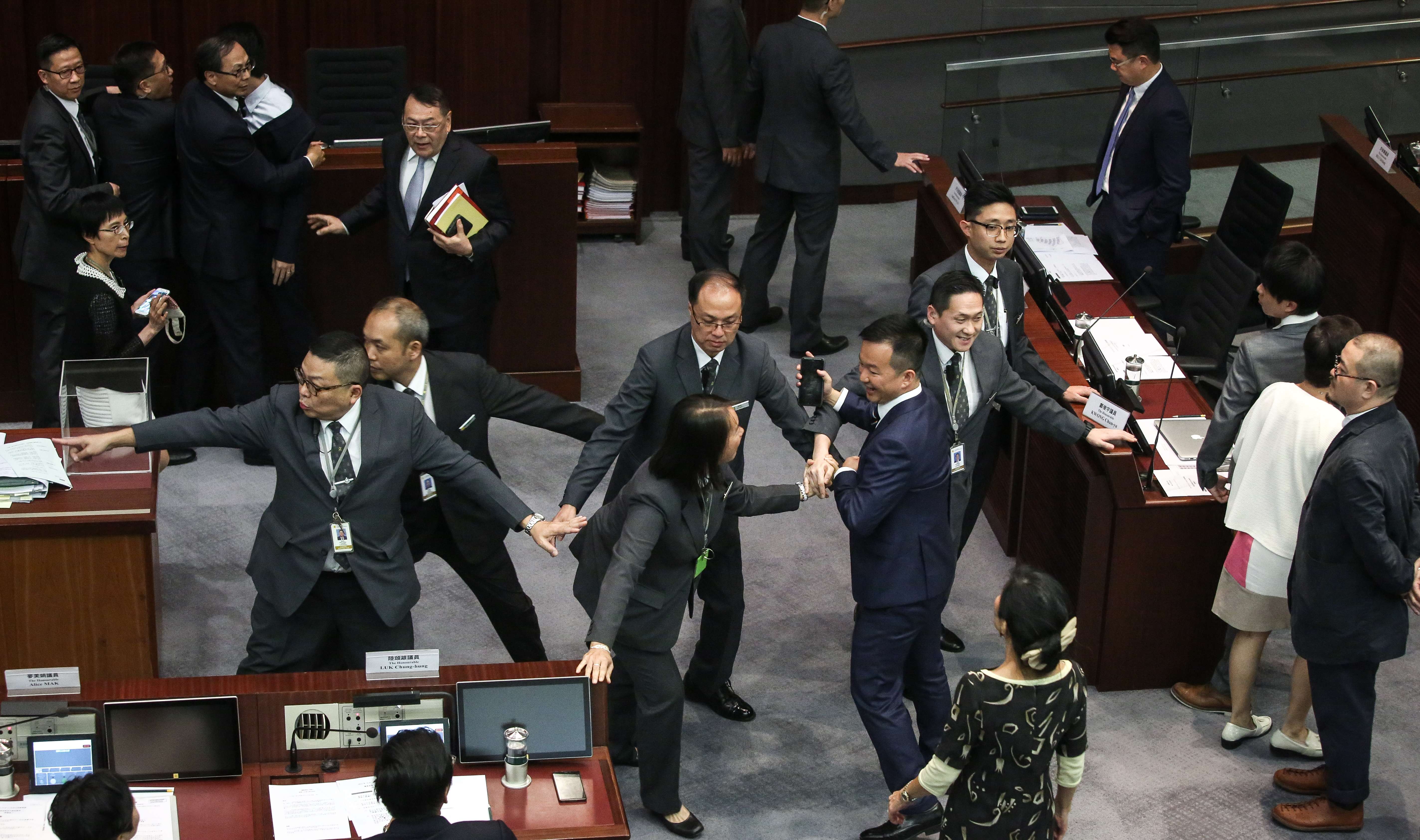 Lawmakers clash during the Legislative Council’s presidential election session, in just one of many angry exchanges at yesterday’s meeting. Photo: Sam Tsang