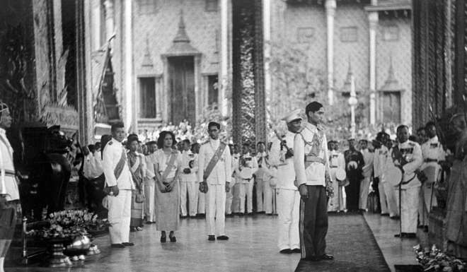 King of Siam Rama VIII or Ananda Mahidol of Thailand stands during an official ceremony on January 1946 in Bangkok after his return from Switzerland to Thailand. Rama VIII born on September 20, 1925 in Heidelberg, Germany, was mostly away pursuing his studies in Switzerland before returning to Thailand in 1945. On June 9, 1946 he was found dead in his bed of a mysterious gunshot wound at the palace in Bangkok. His brother King Bhumibol Adlyadej succeeded him on the throne. / AFP PHOTO