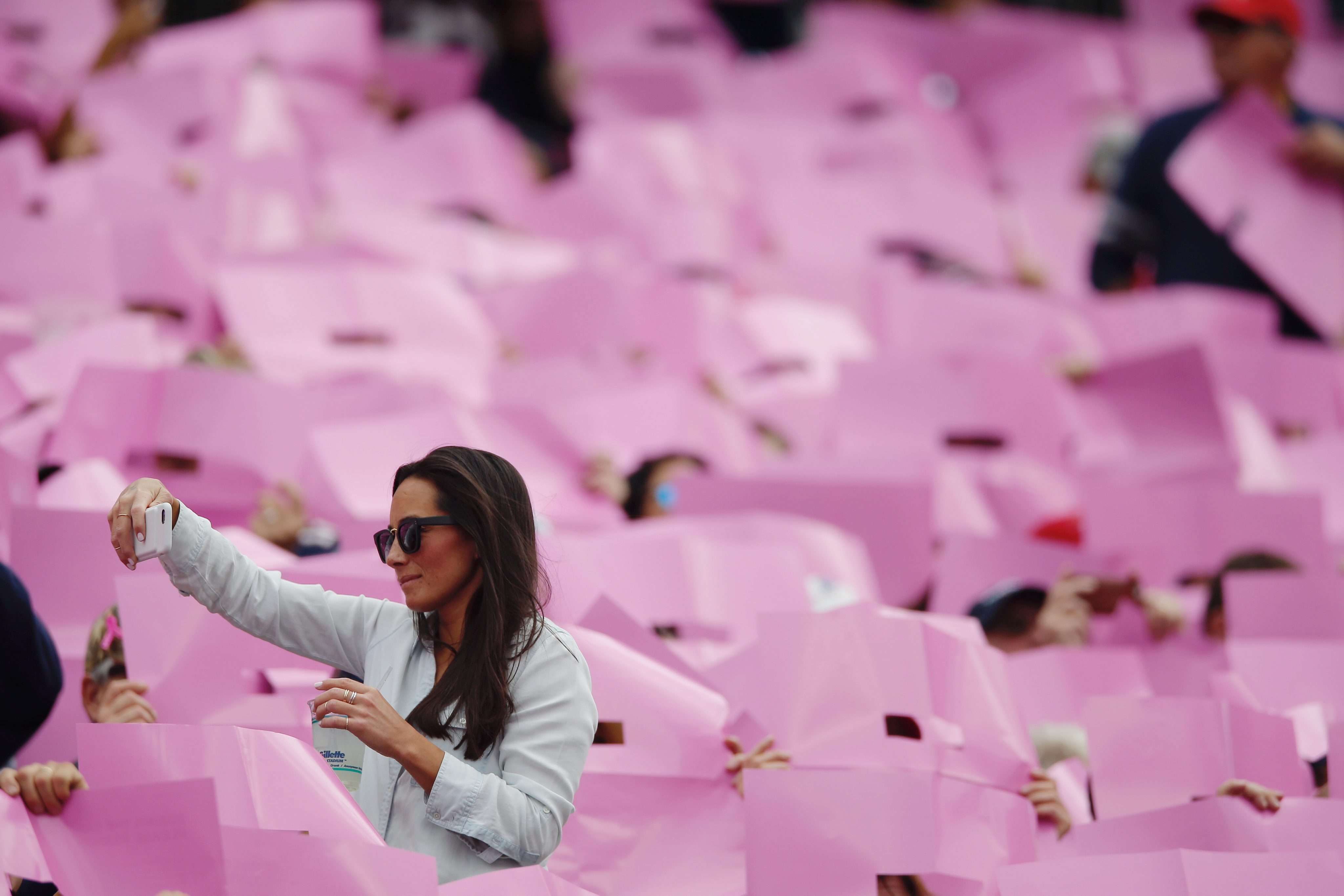 People in Gillette Stadium, in Foxboro, Massachusetts, mark breast cancer awareness month during a football game. With the advent of social media, there is a perception at times that the disease has been tamed. Photo: EPA