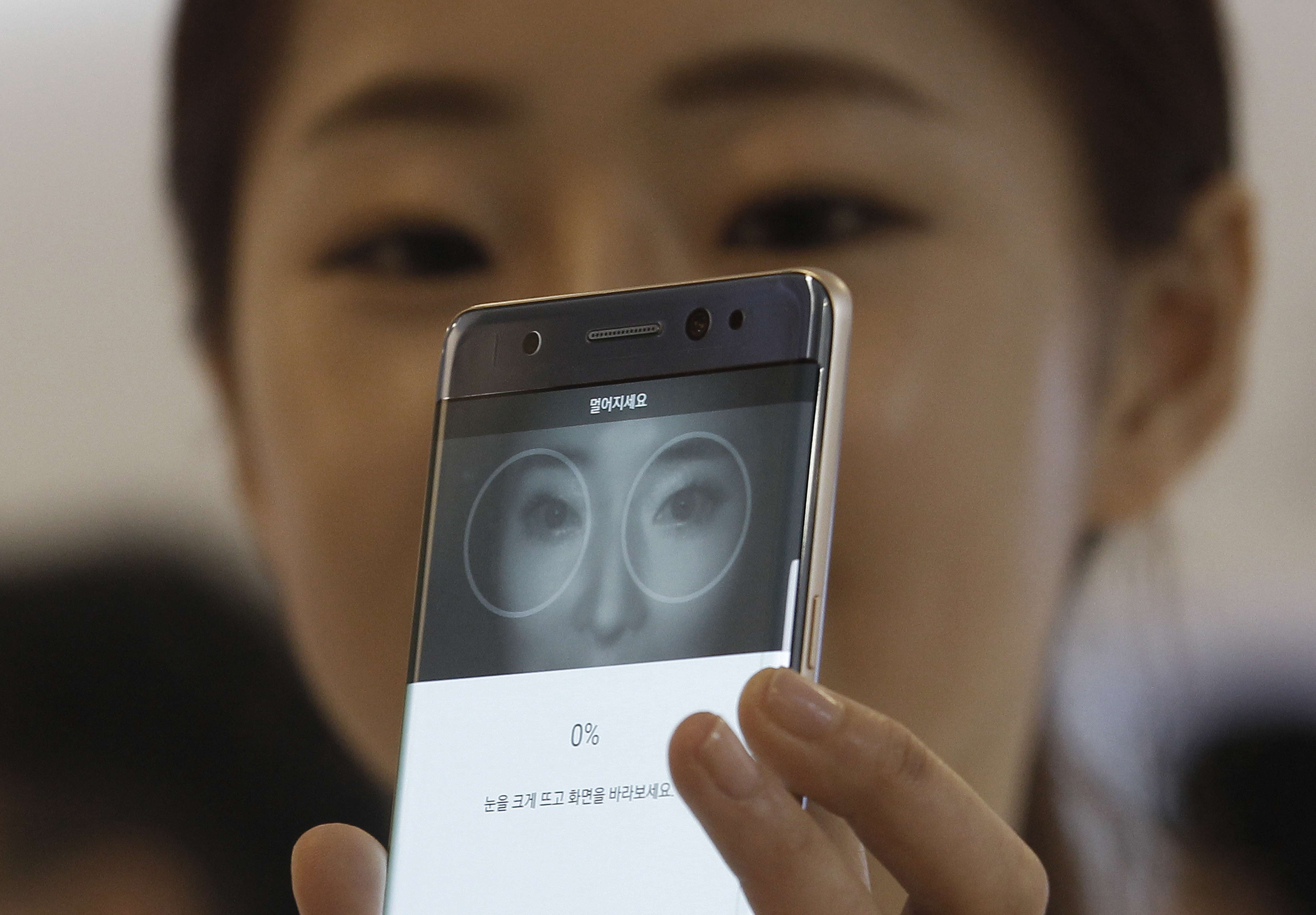 A model demonstrates the iris scanner features of the Galaxy Note 7 during its launch in August. Two months later, the phone has cast a deep shadow on Samsung’s reputation. Photo: AP