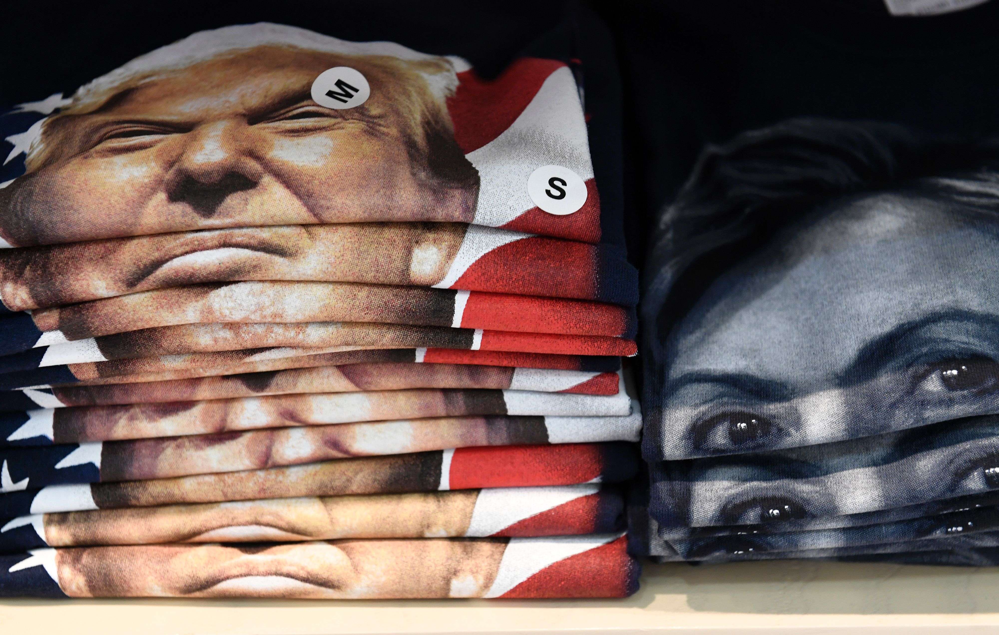 T-shirts supporting either US Republican presidential nominee Donald Trump or Democratic presidential nominee Hillary Clinton are displayed for sale in a gift shop at Philadelphia International Airport. Photo: AFP