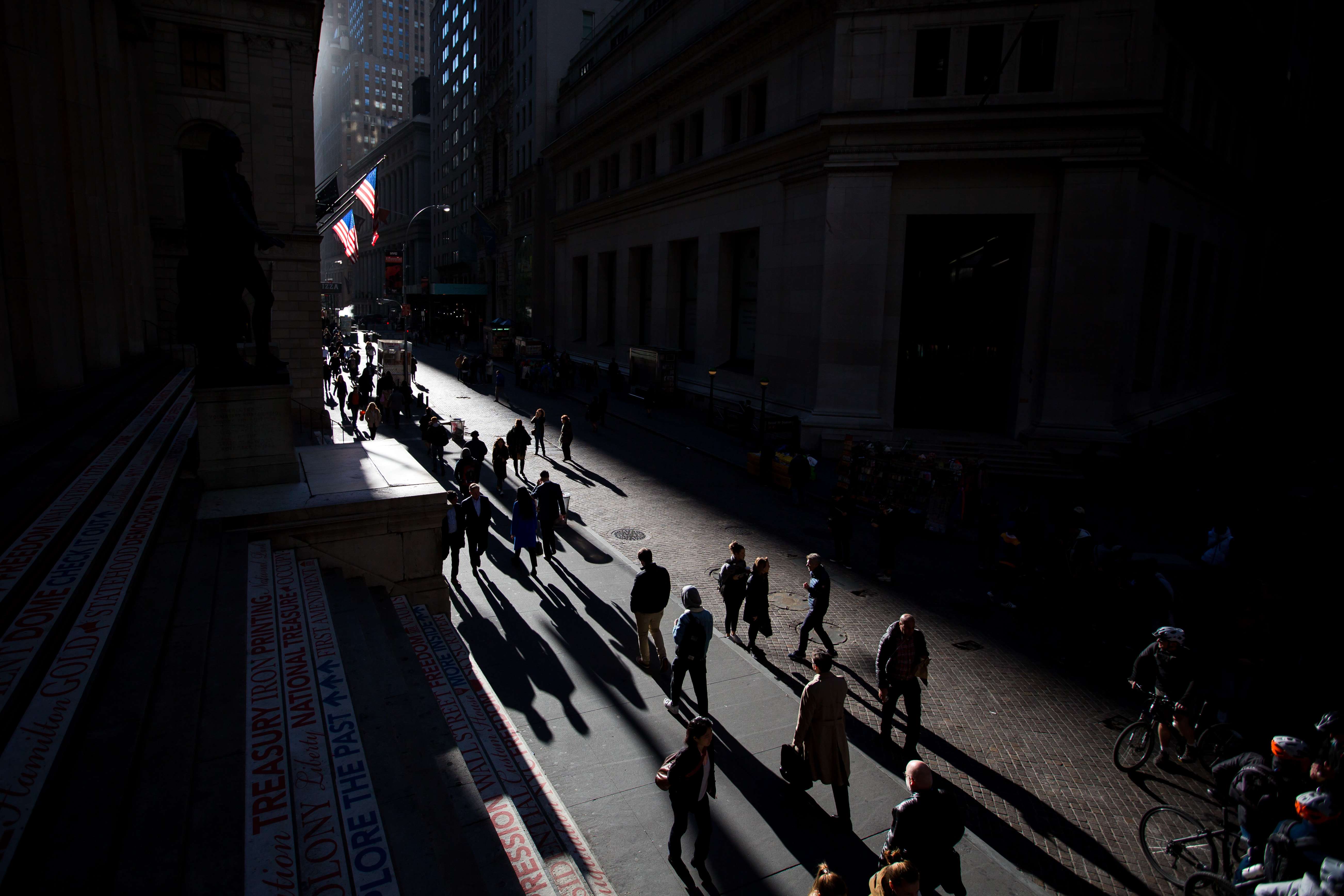 Pedestrians walk along Wall Street in New York. America was a child of the Enlightenment and it would embrace the most universal and advanced principles available. Photo: Bloomberg