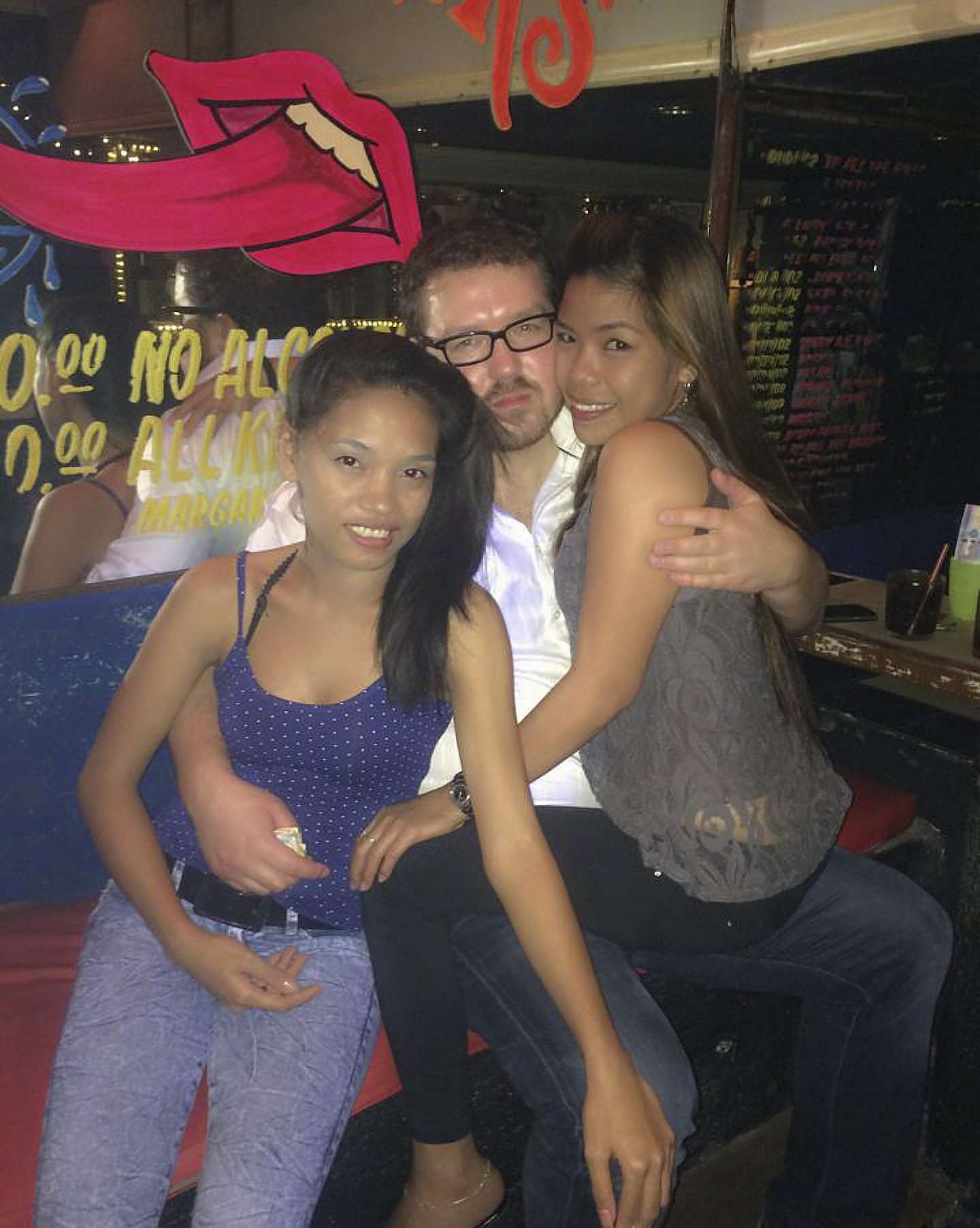 Rurik Jutting with his last girlfriend Joanna Mendoza (right) and another girl in Club Rio, Angeles City. Picture: Red Door News Hong Kong